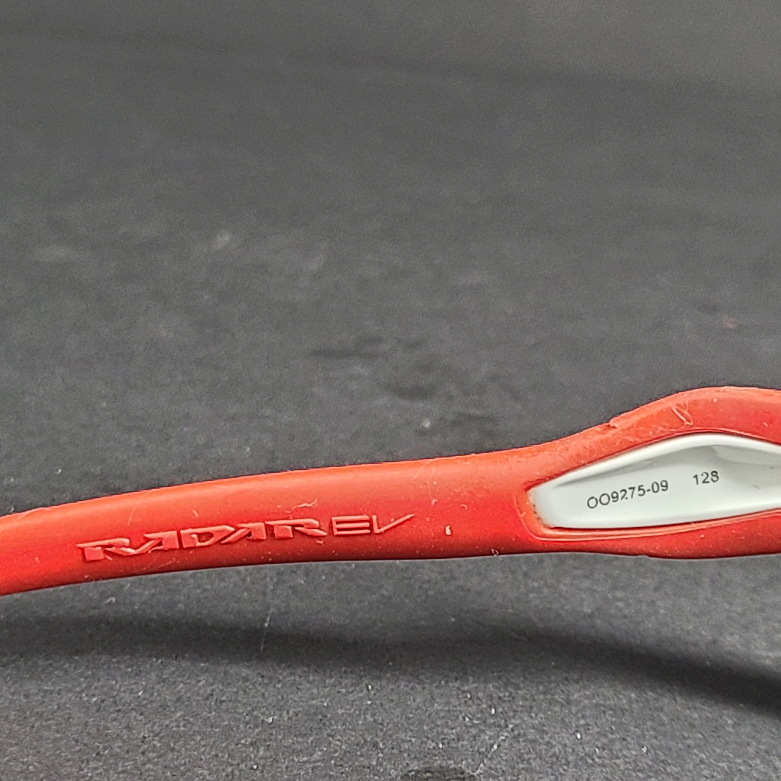 Oakley Radar EV Path lens kit with red, white and blue accents and an extra replacement lens, packaged with an original case.