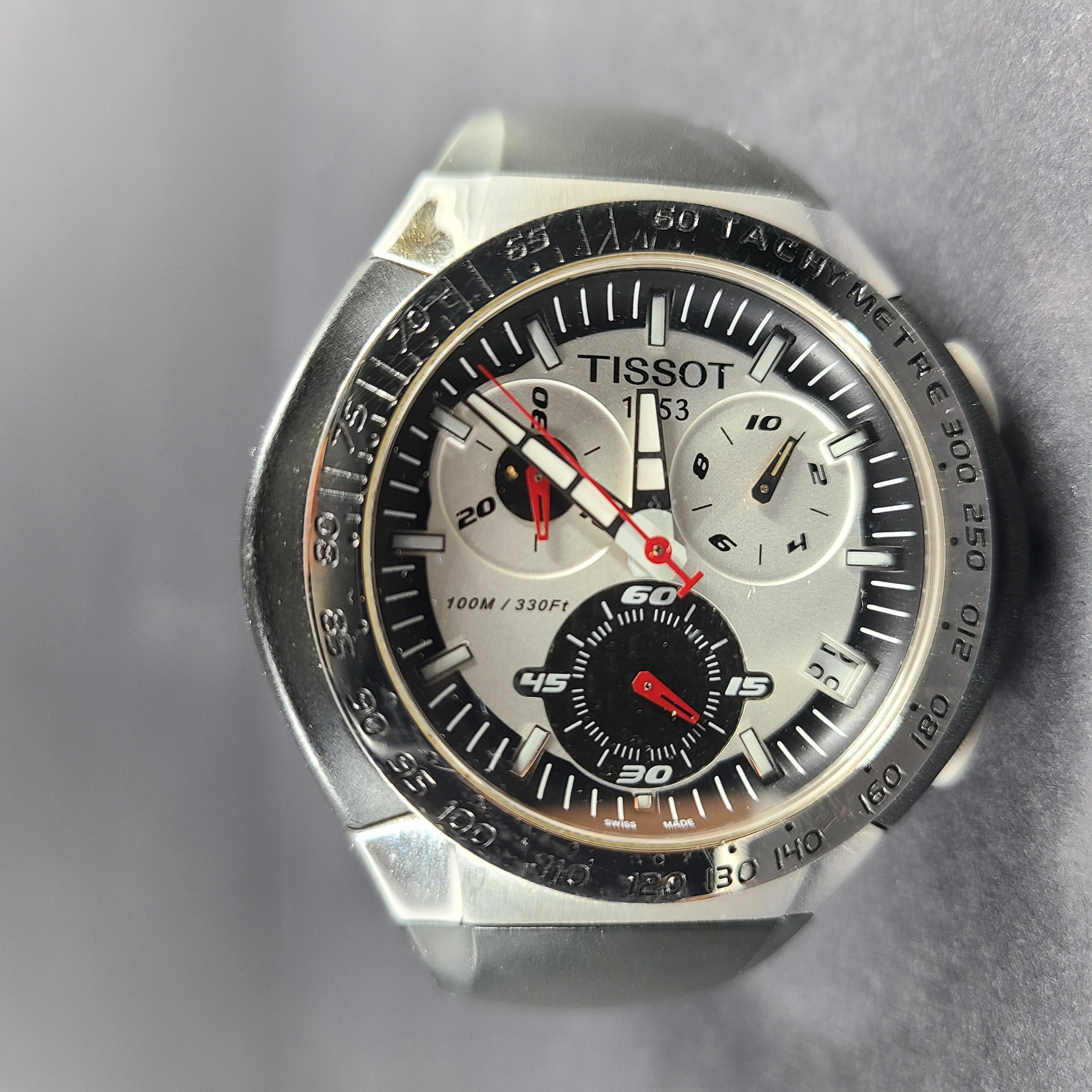 Tissot T Navigator 3000 stainless steel wristwatch with black dial and metal bracelet.