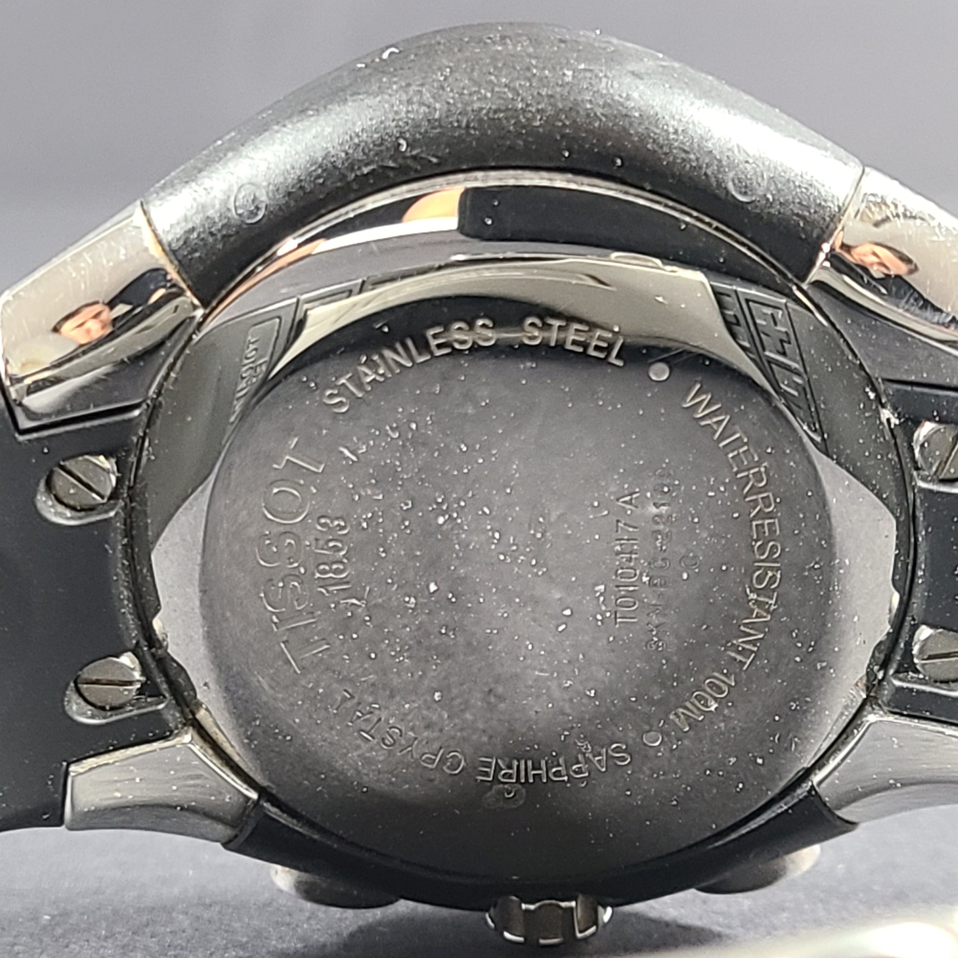 Tissot T Navigator 3000 stainless steel wristwatch with black dial and metal bracelet.