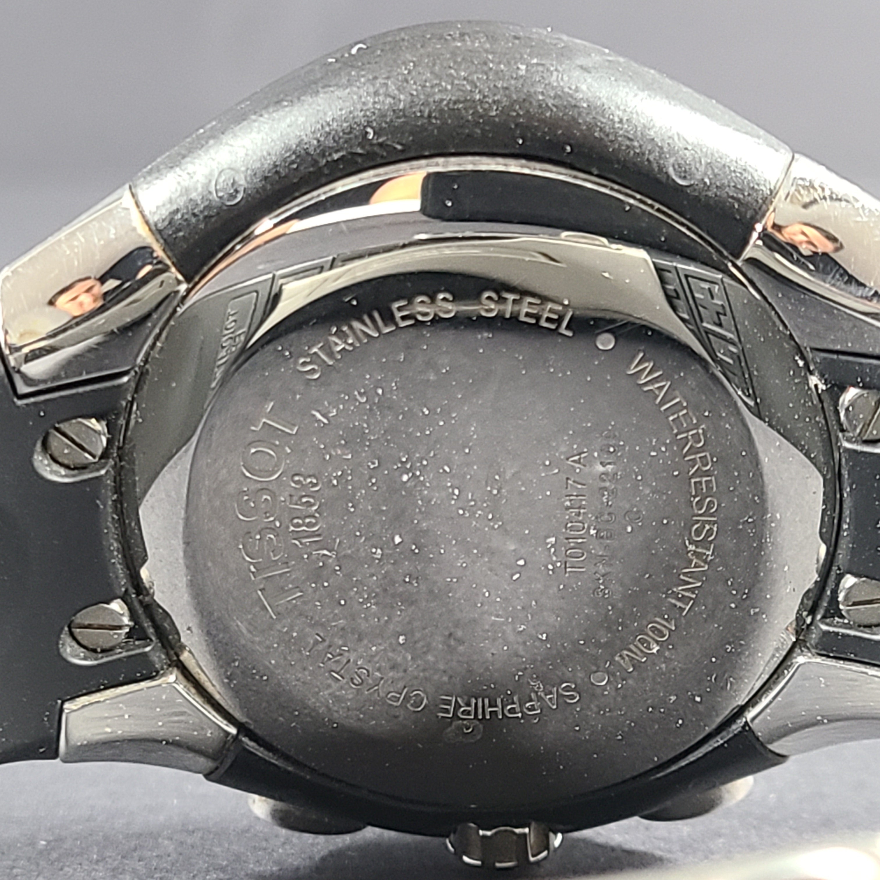 Tissot T Navigator 3000 stainless steel wristwatch with black dial and metal bracelet.