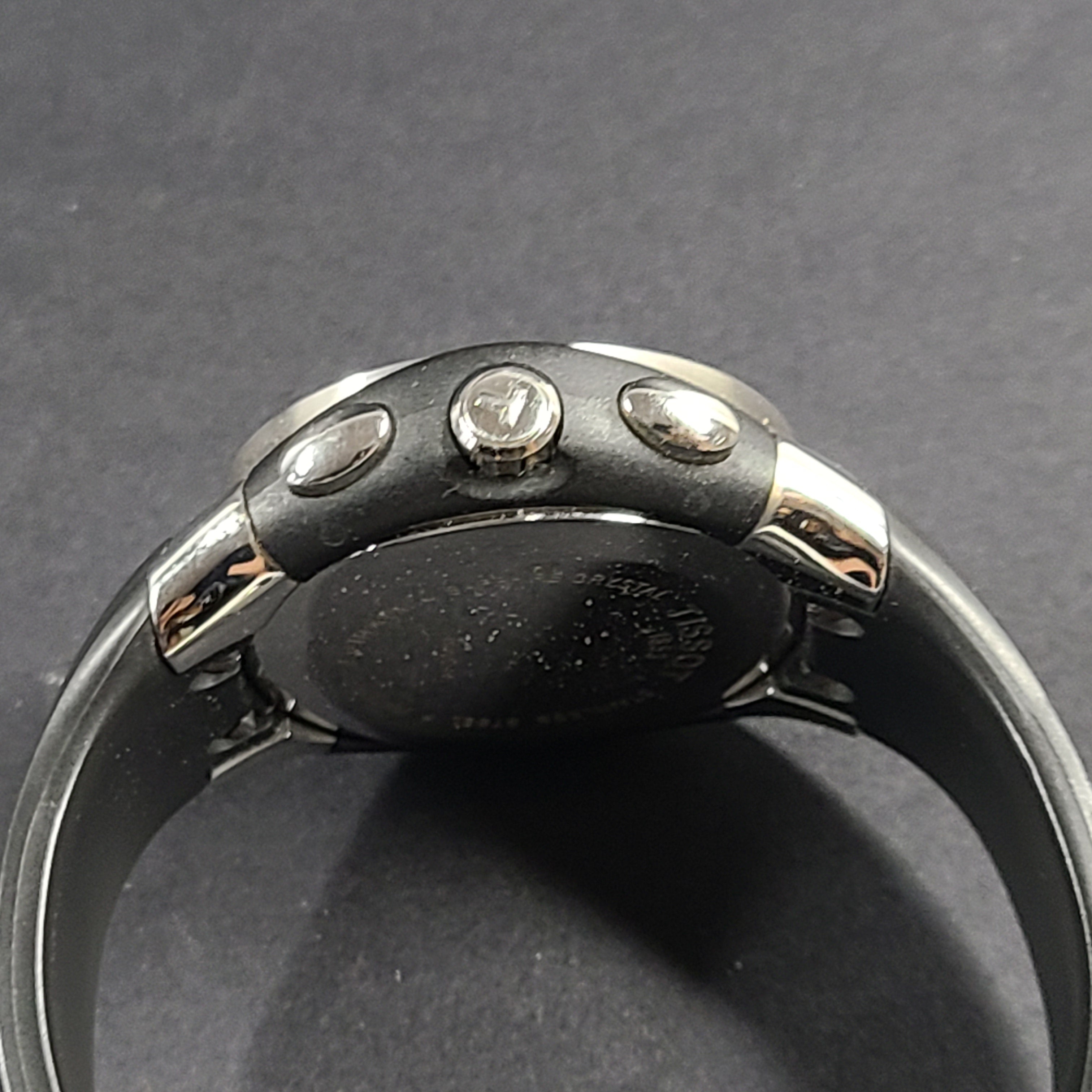 Tissot T Navigator 3000 stainless steel wristwatch with black dial and metal bracelet.