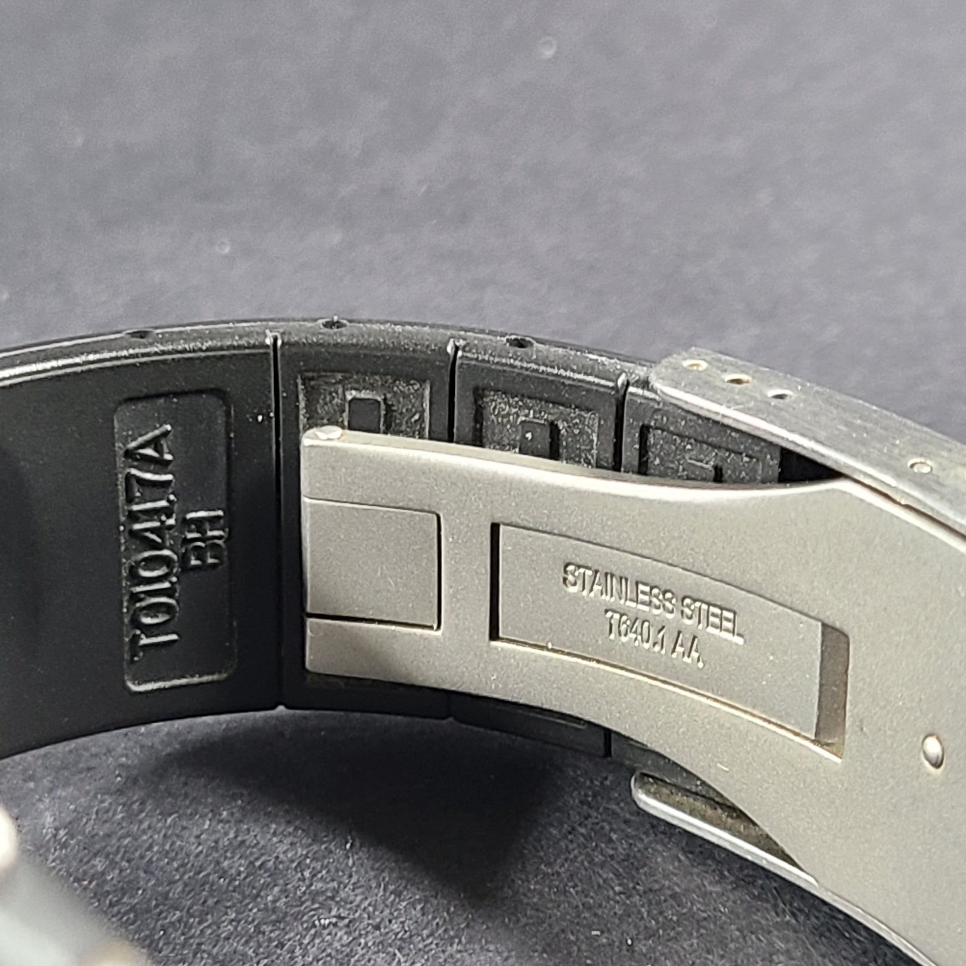 Tissot T Navigator 3000 stainless steel wristwatch with black dial and metal bracelet.