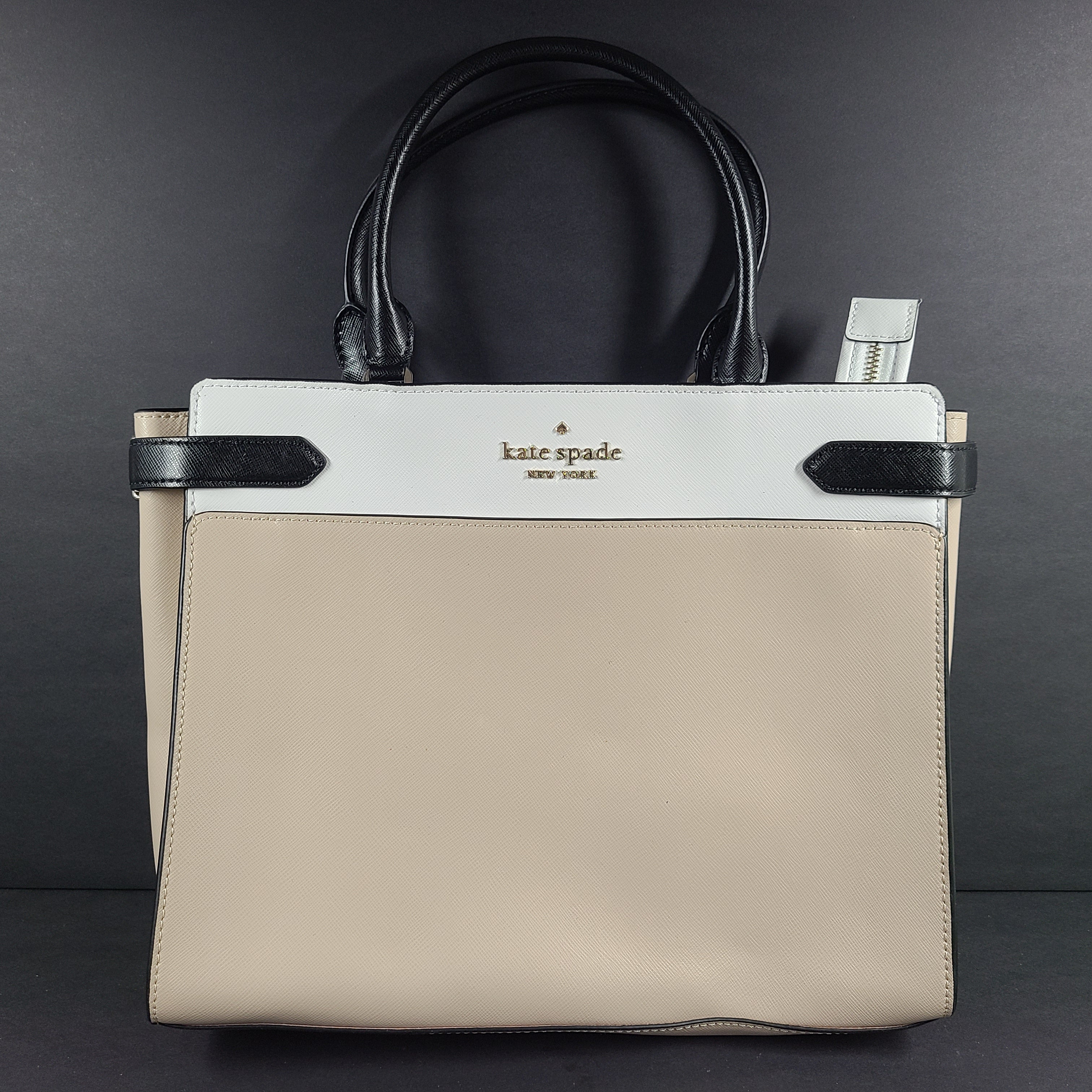 Kate Spade New York beige and black tote with shoulder strap and interior logo label.