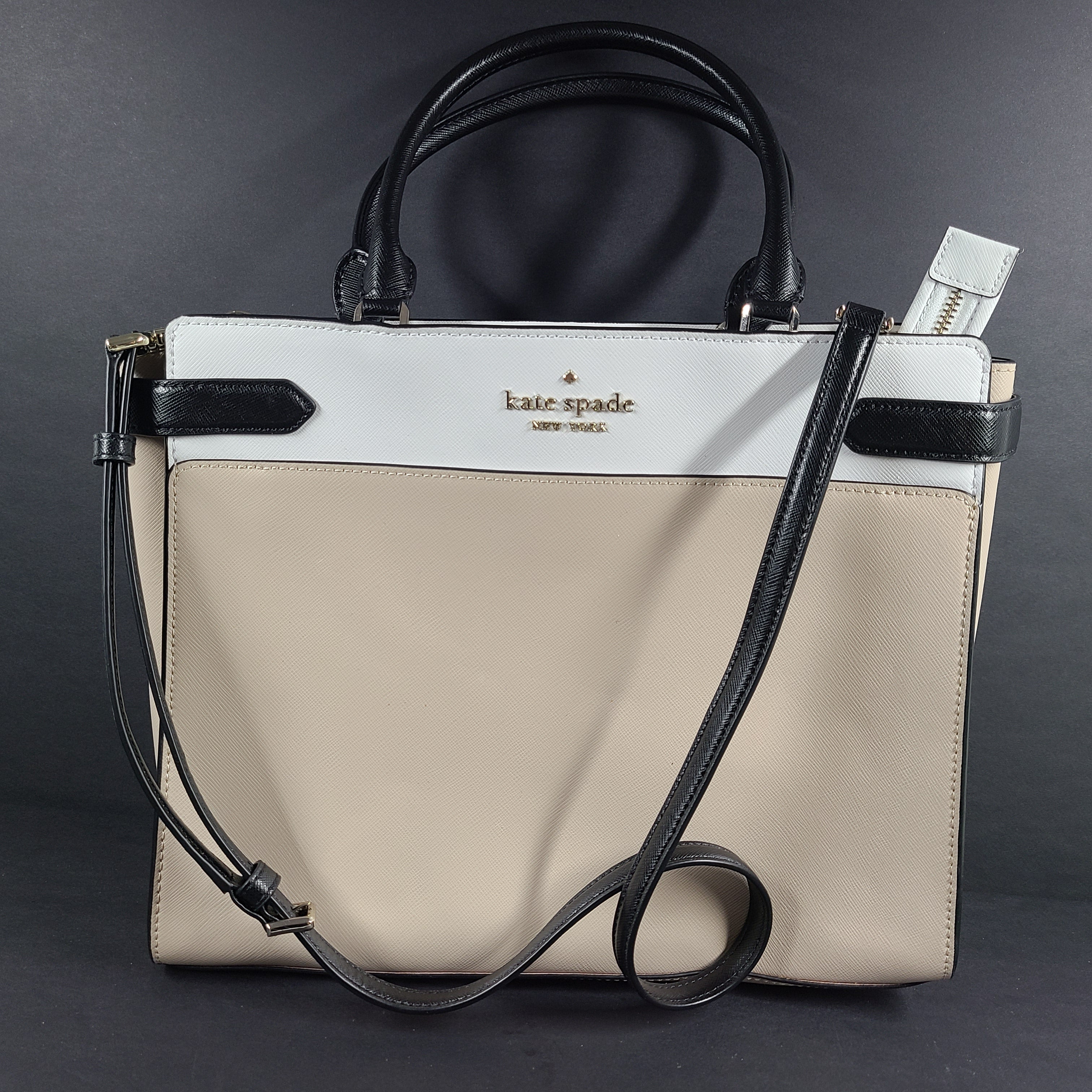 Kate Spade New York beige and black tote with shoulder strap and interior logo label.