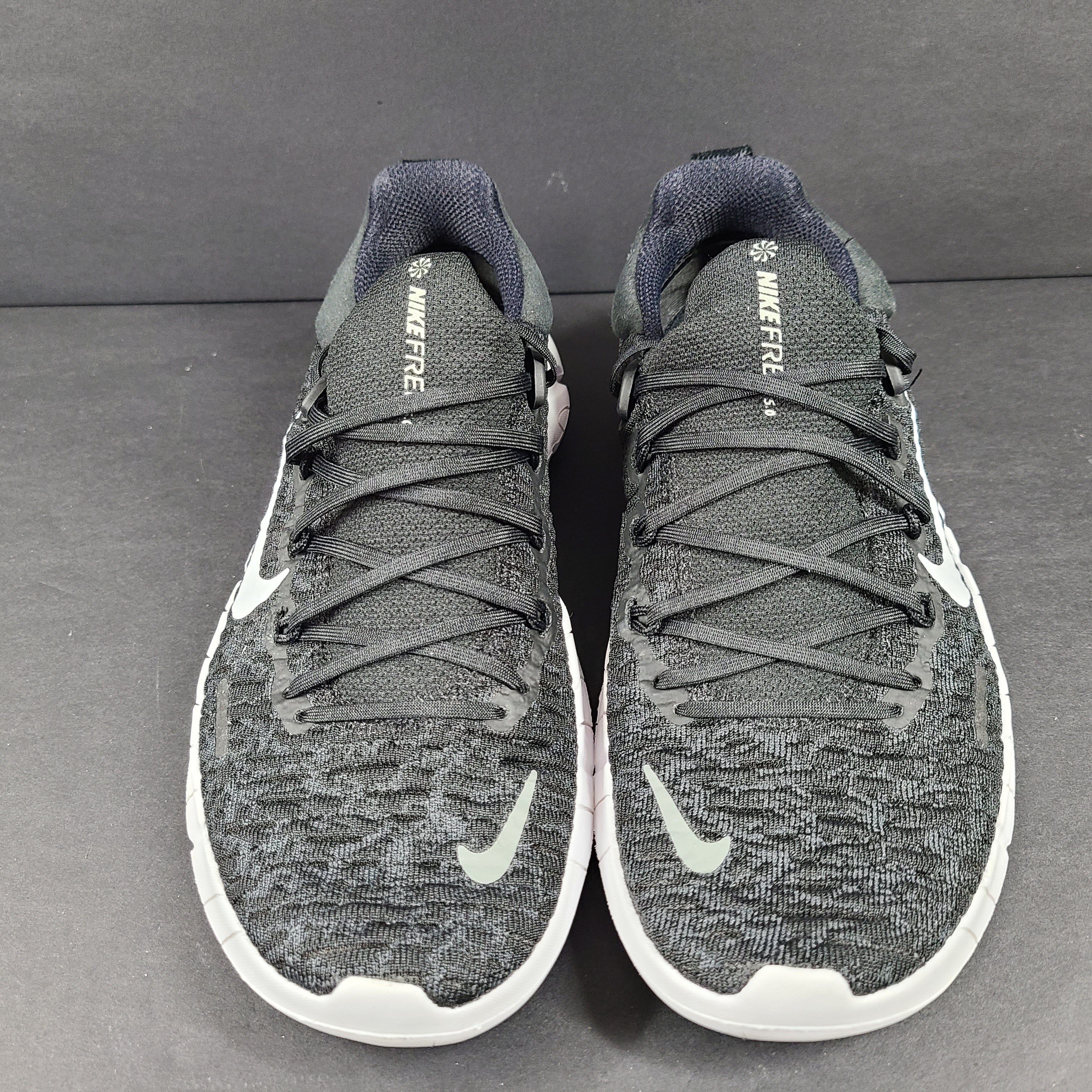 Black and gray Nike Free Metcon 3 training shoes in US size 6.5 with white accents and a low-profile sole.