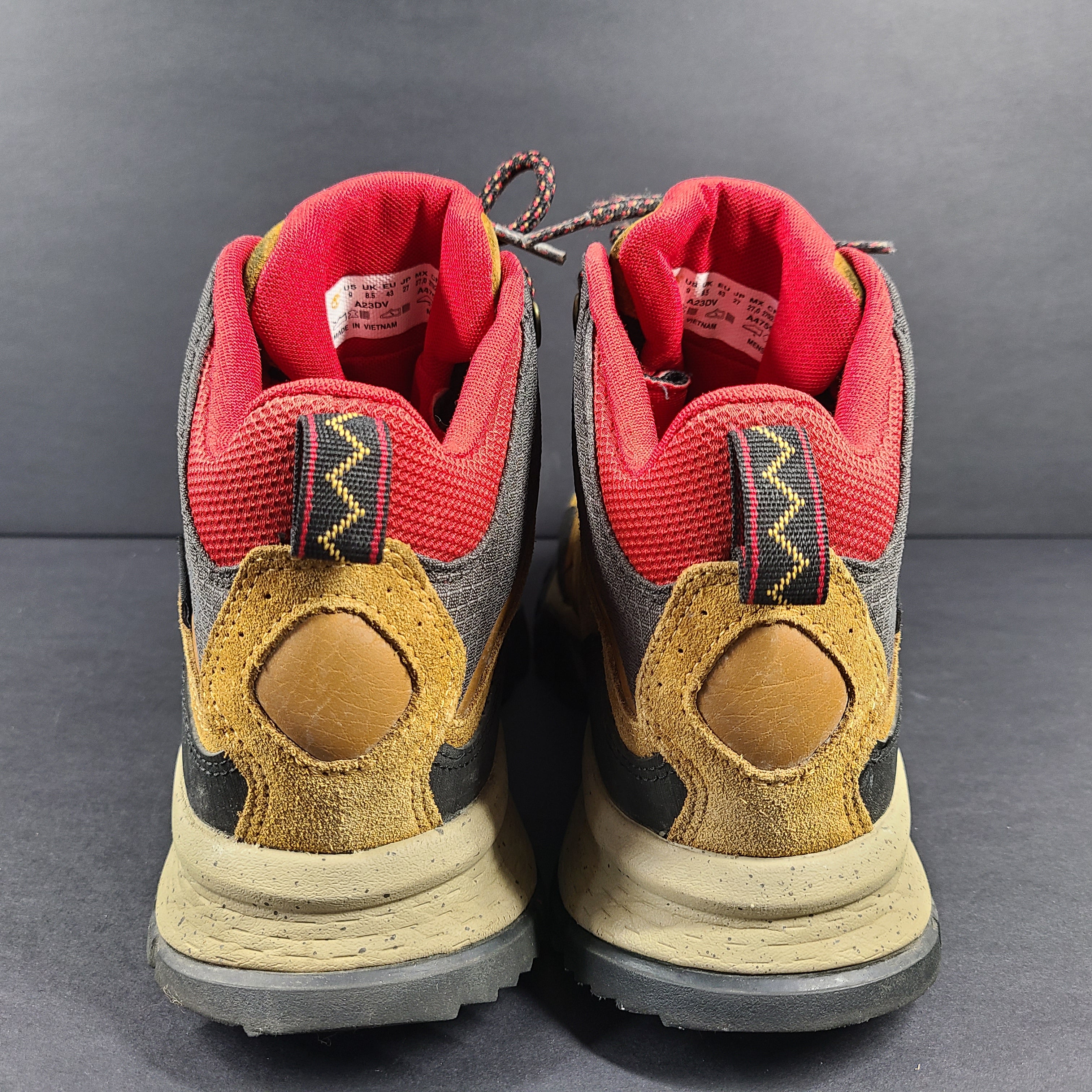 Timberland A23DV men's trail boots in brown and red with Timbergrip soles and US 9 sizing.