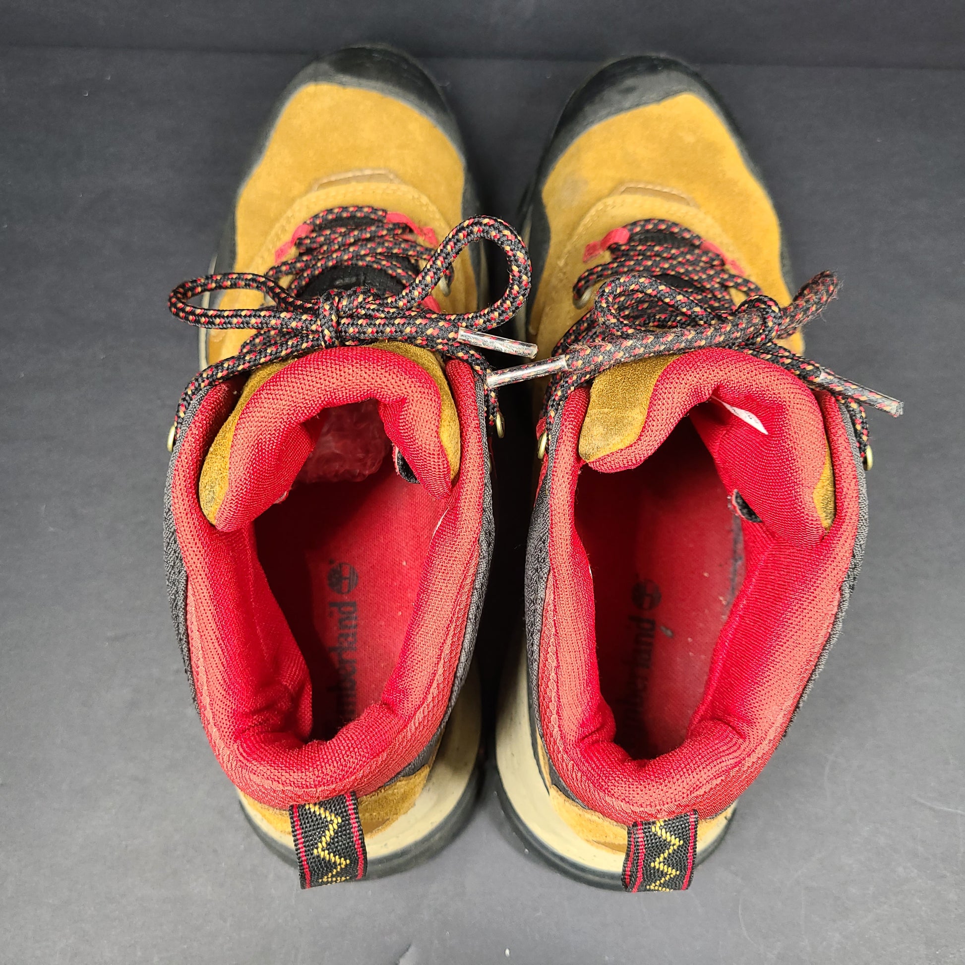 Timberland A23DV men's trail boots in brown and red with Timbergrip soles and US 9 sizing.