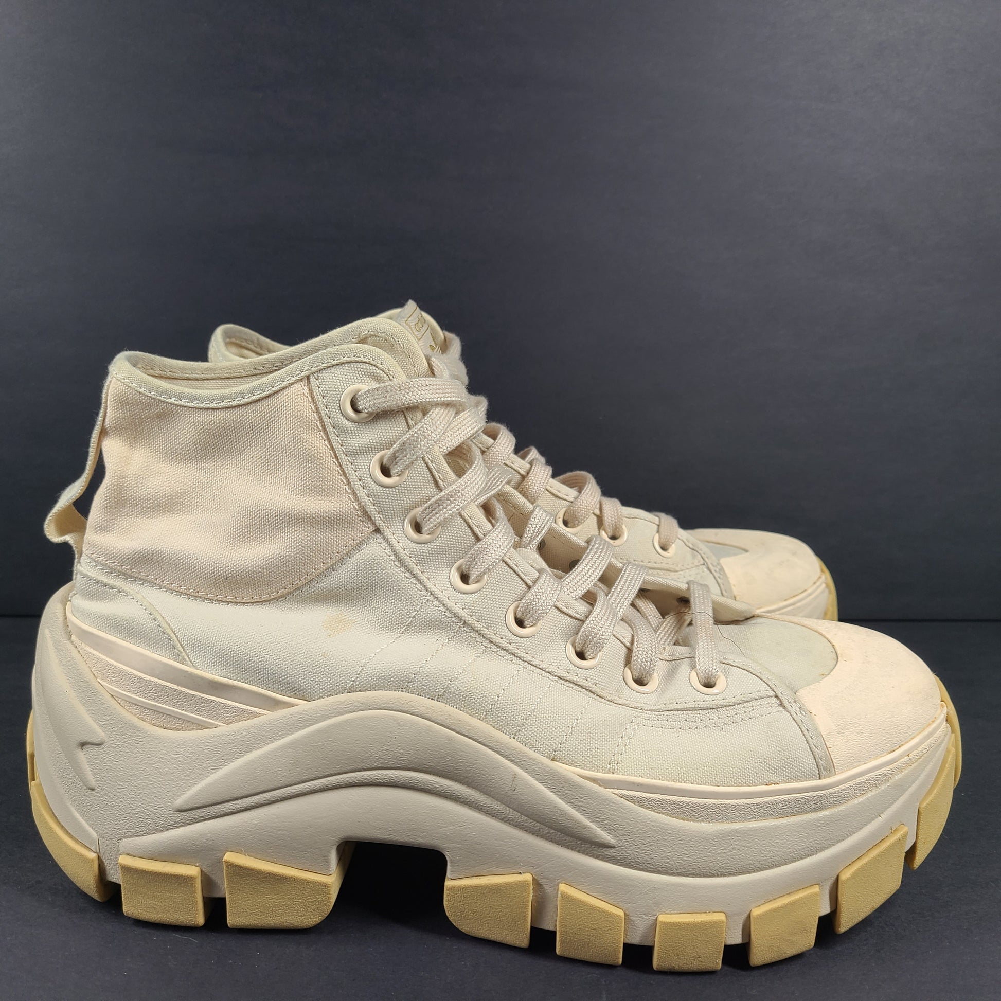 Adidas Nizza Hi XY22 beige high-top sneakers with a platform profile and gum outsole.
