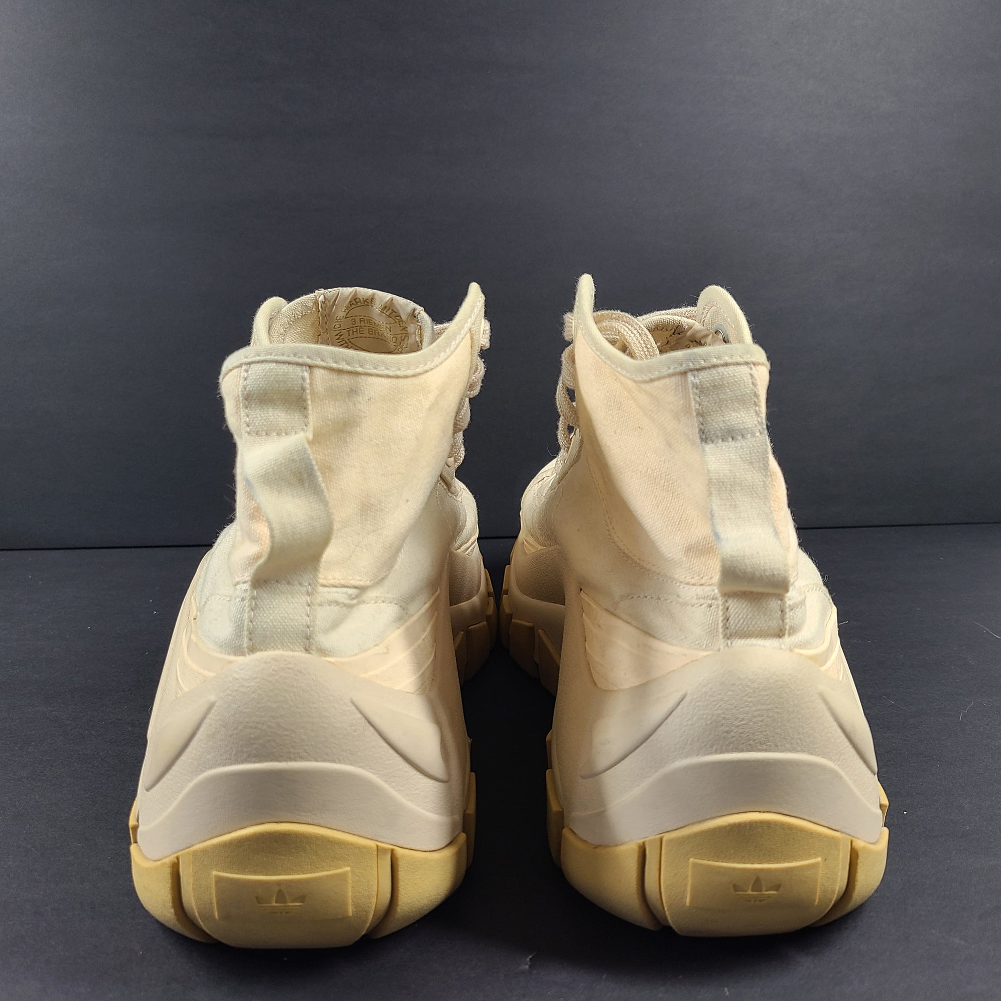 Adidas Nizza Hi XY22 beige high-top sneakers with a platform profile and gum outsole.