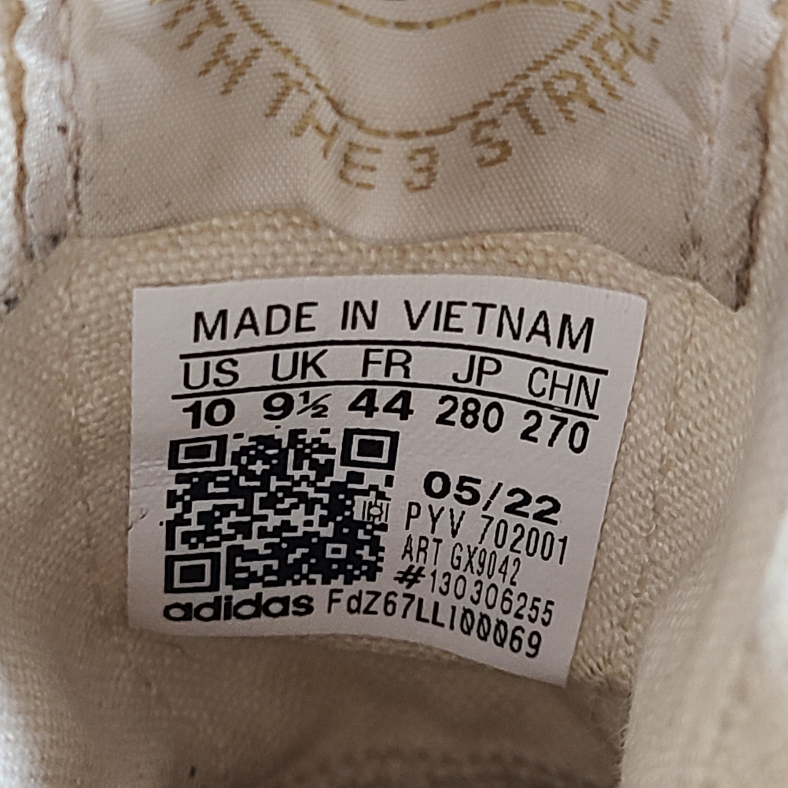 Adidas Nizza Hi XY22 beige high-top sneakers with a platform profile and gum outsole.