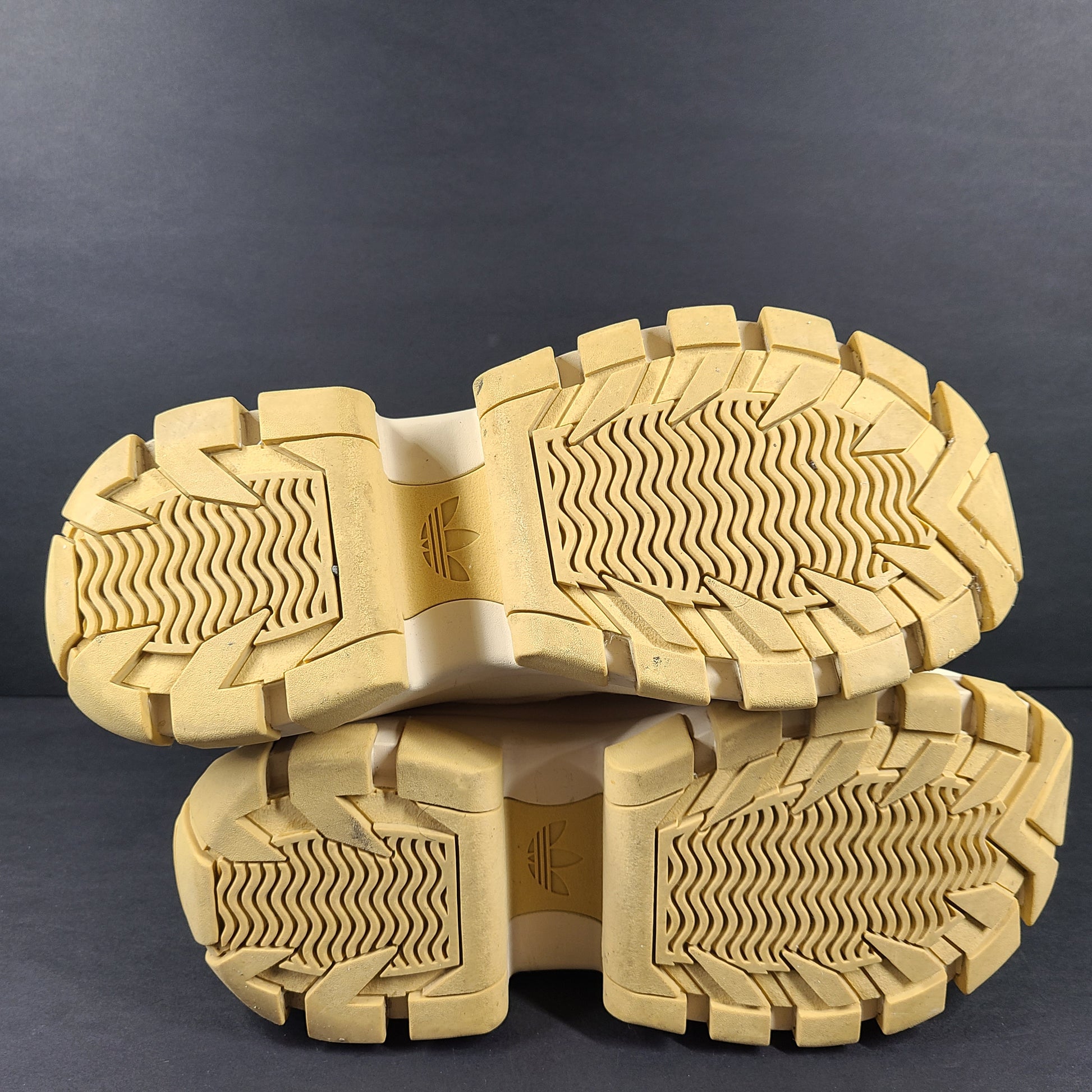 Adidas Nizza Hi XY22 beige high-top sneakers with a platform profile and gum outsole.