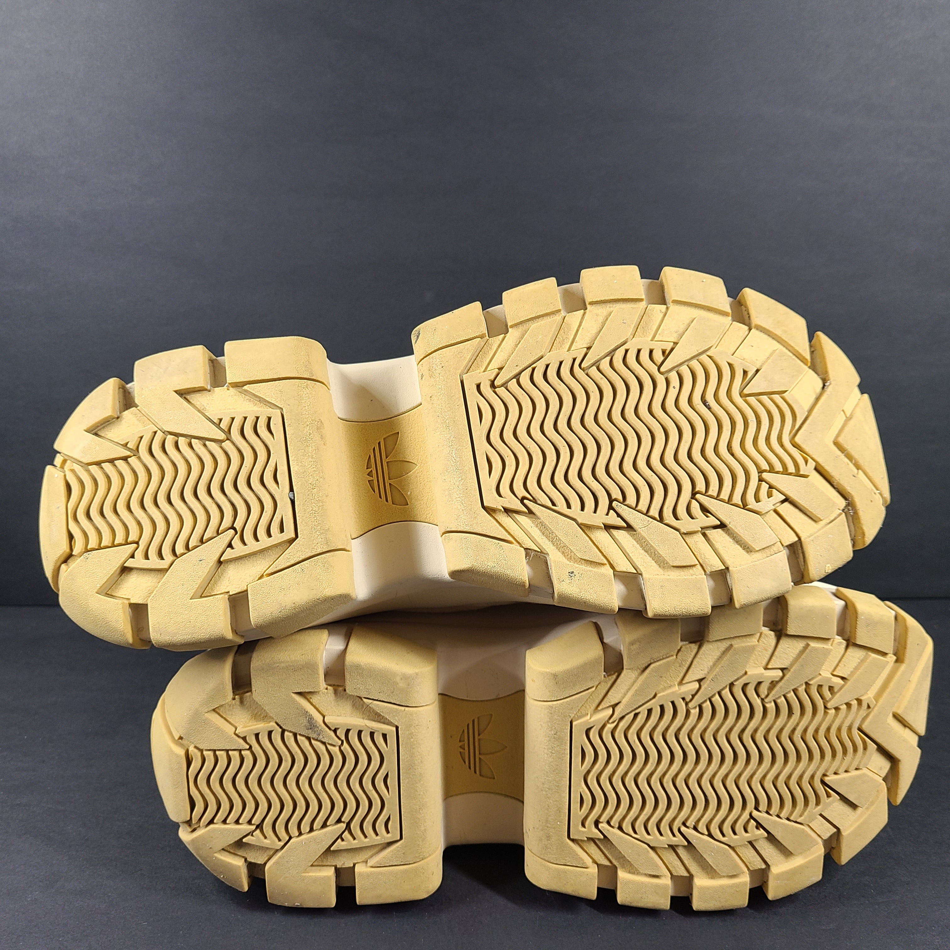 Adidas Nizza Hi XY22 beige high-top sneakers with a platform profile and gum outsole.
