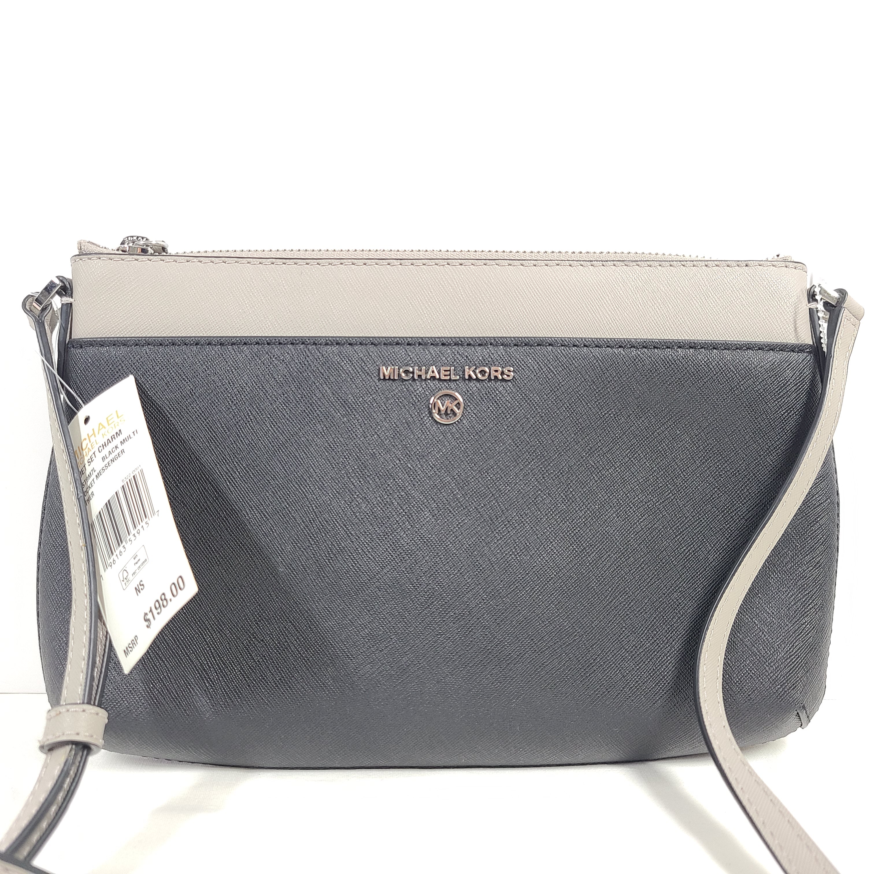 A Michael Kors AB-2204 crossbody bag in gray and beige with an attached strap and clean modern silhouette.