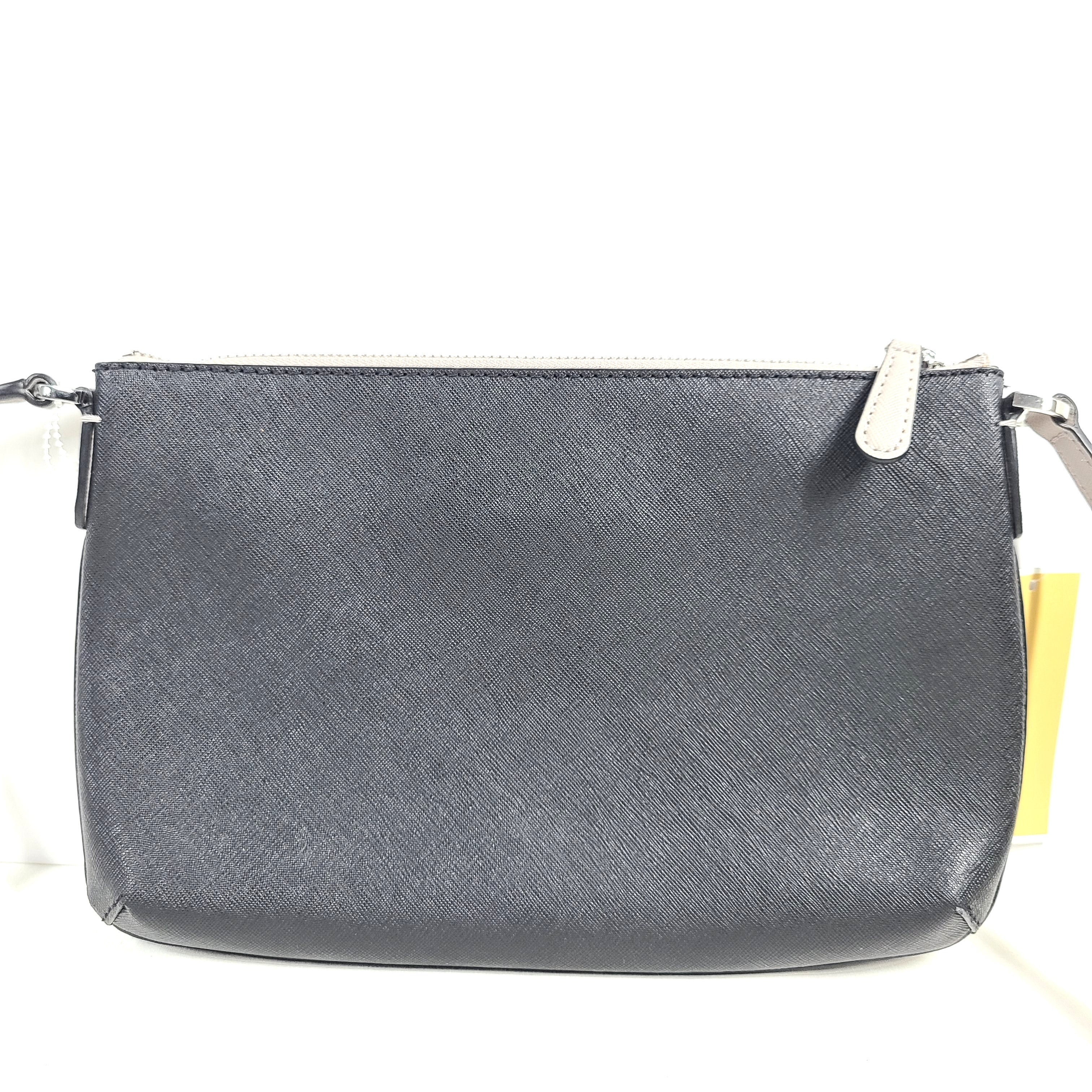 A Michael Kors AB-2204 crossbody bag in gray and beige with an attached strap and clean modern silhouette.