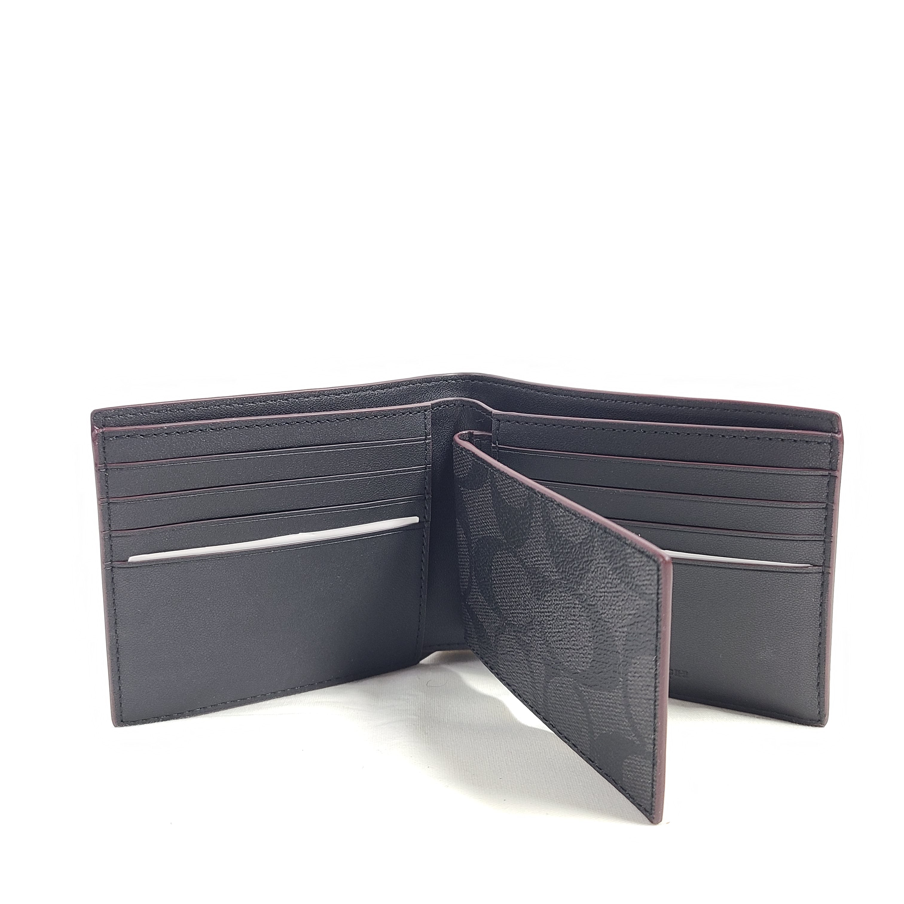 Black Coach signature compact wallet model F58312 with clean trim and barcode tag.