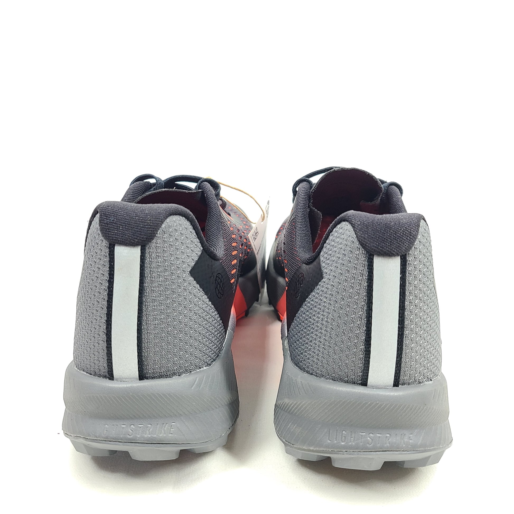 Black, orange, and gray Adidas Terrex Agravic Flow trail running shoe in US size 8 with responsive cushioning and a grippy outsole.