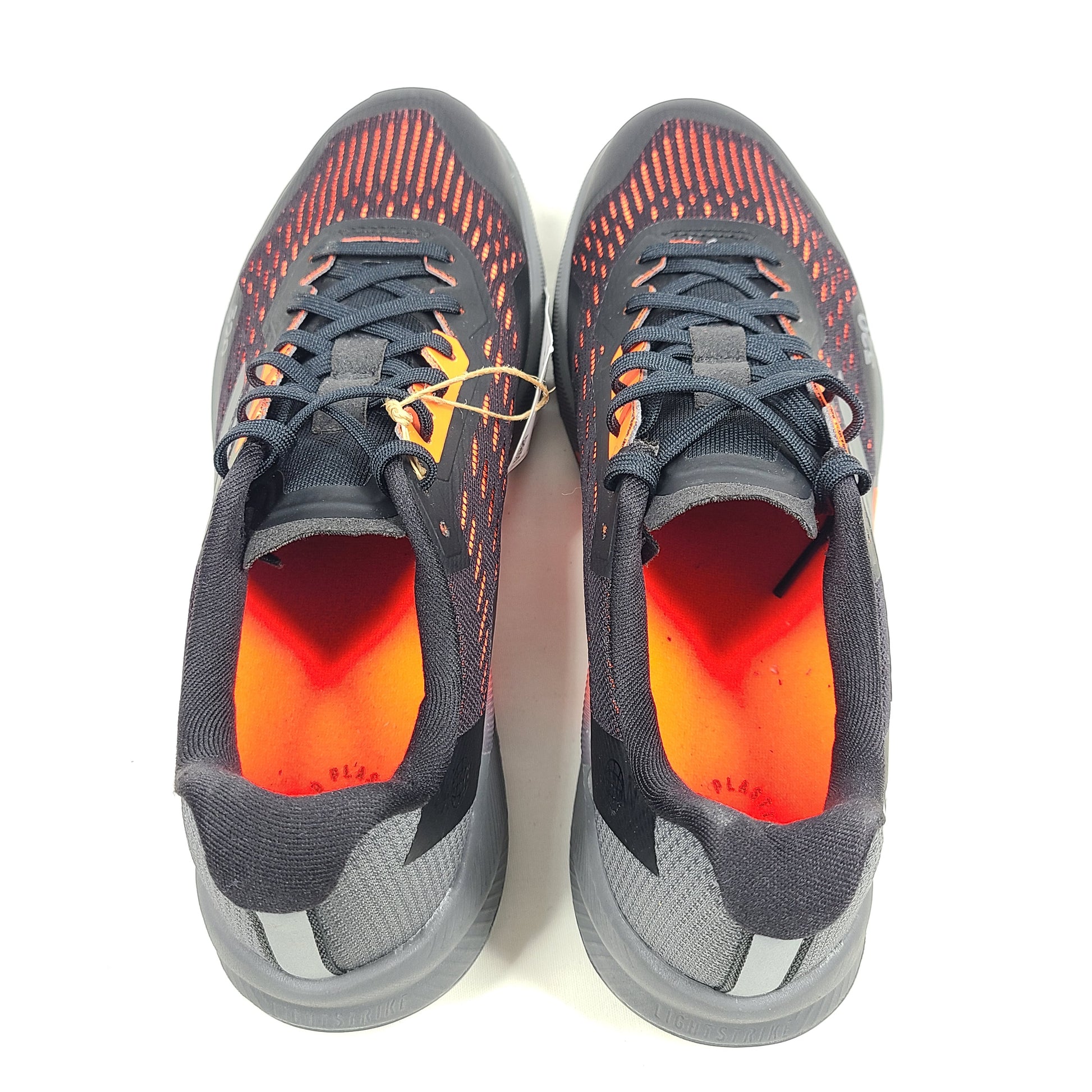 Black, orange, and gray Adidas Terrex Agravic Flow trail running shoe in US size 8 with responsive cushioning and a grippy outsole.