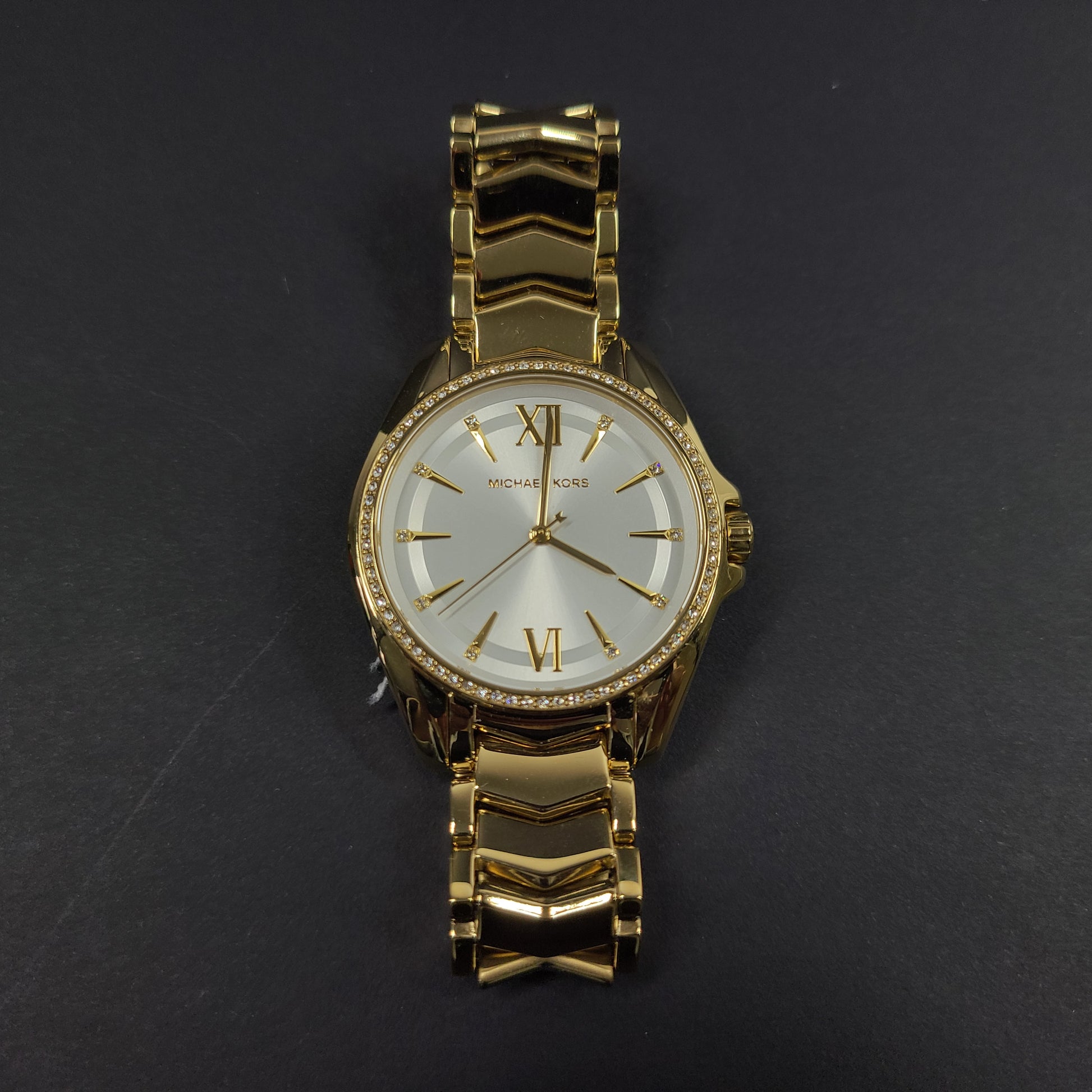 Gold-tone Michael Kors MK6692 women's analog stainless steel watch with white dial and linked bracelet.