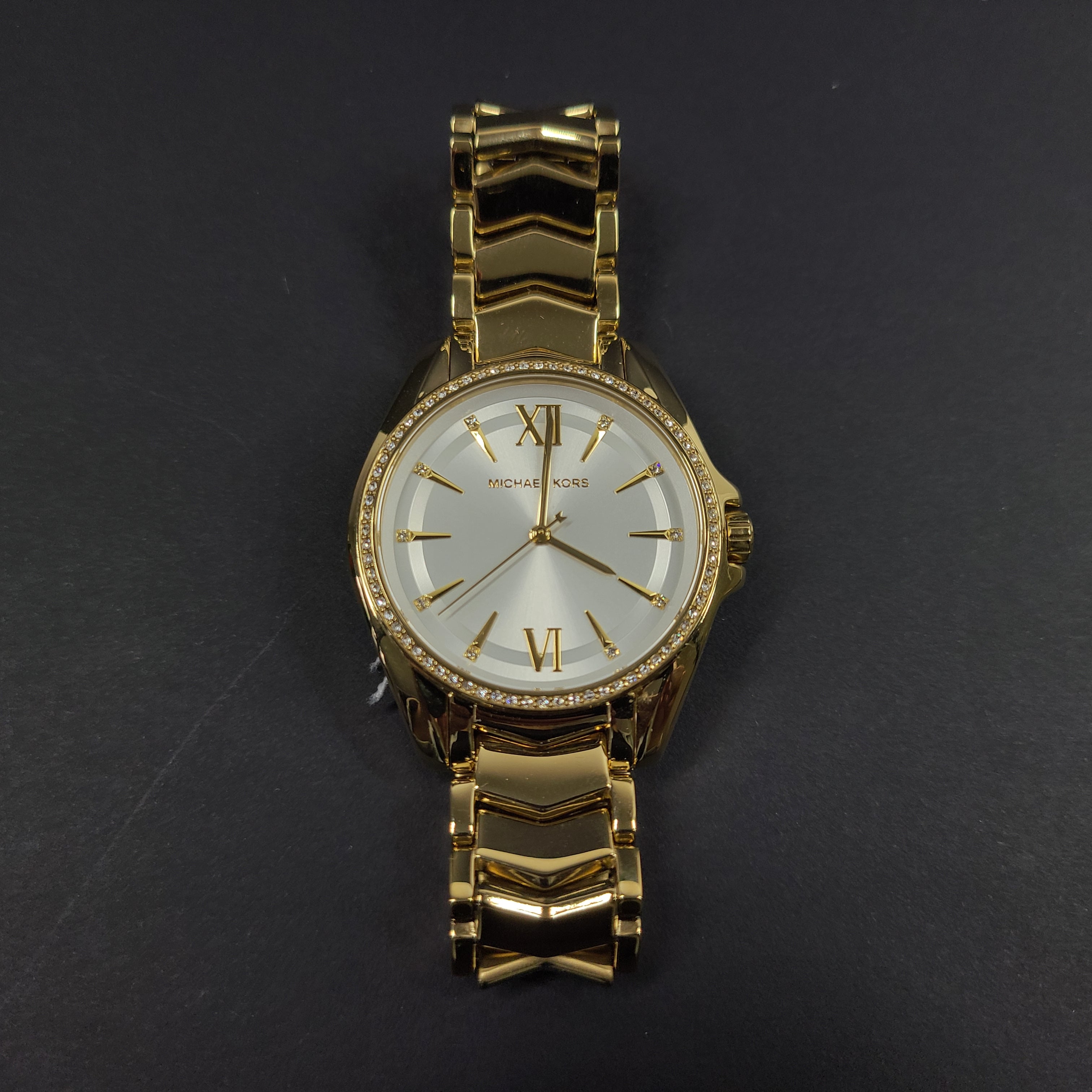 Gold-tone Michael Kors MK6692 women's analog stainless steel watch with white dial and linked bracelet.