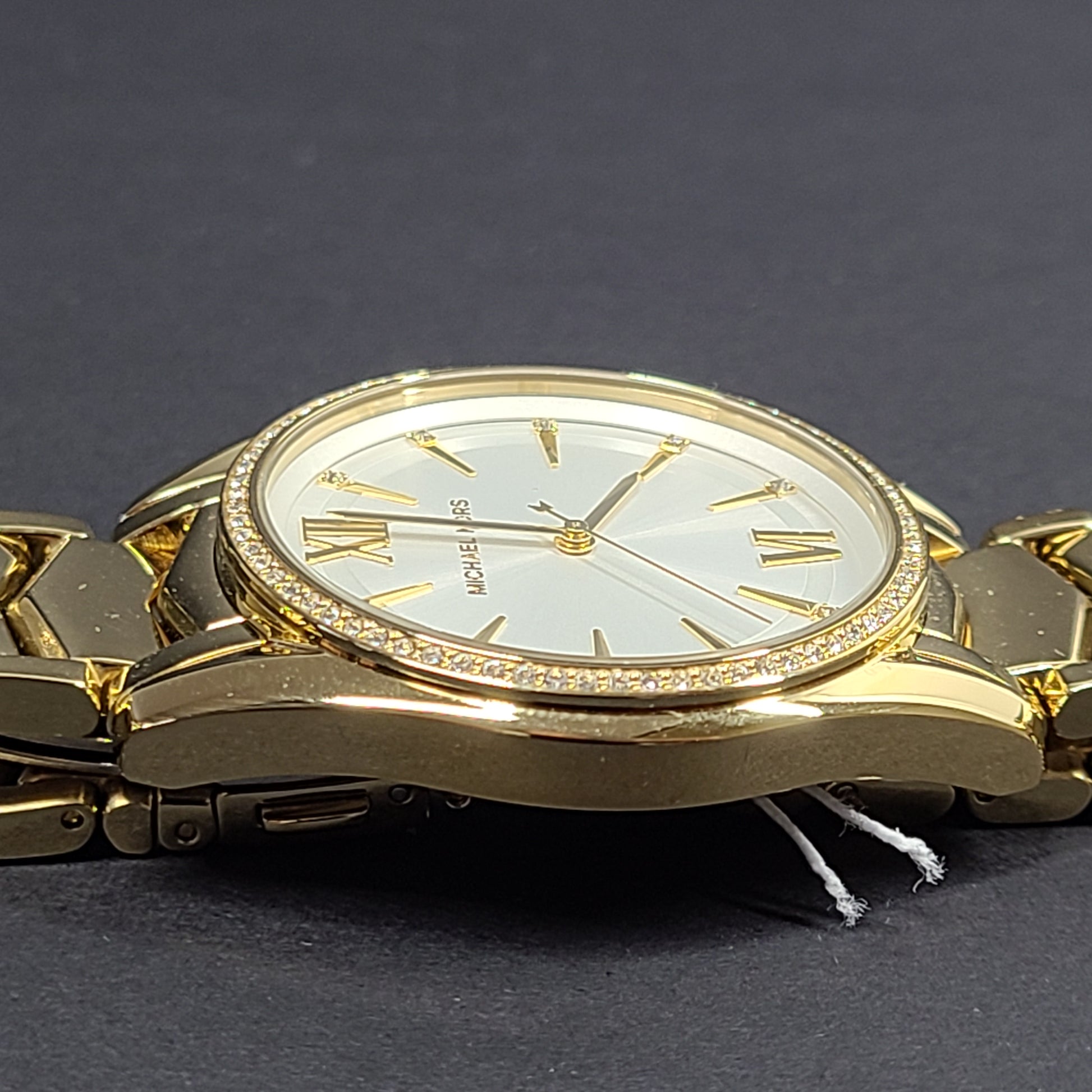 Gold-tone Michael Kors MK6692 women's analog stainless steel watch with white dial and linked bracelet.
