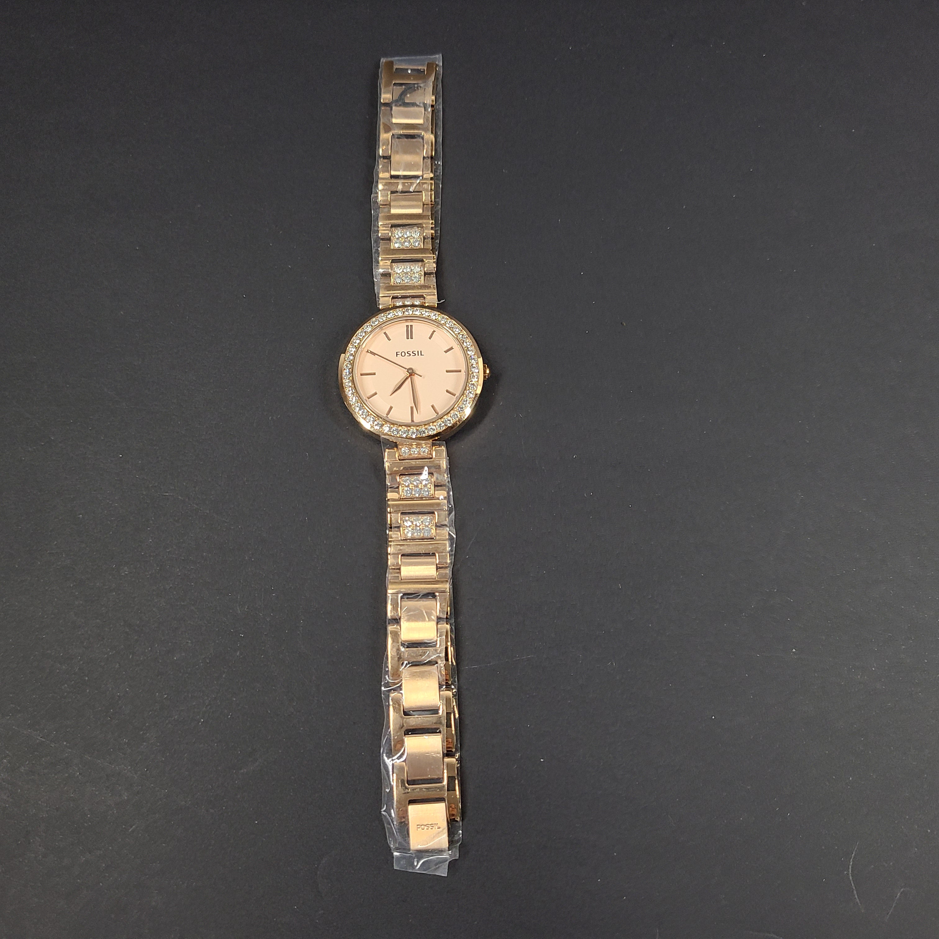 Rose gold Fossil Karli three-hand stainless steel watch with a minimalist round dial and bracelet band.