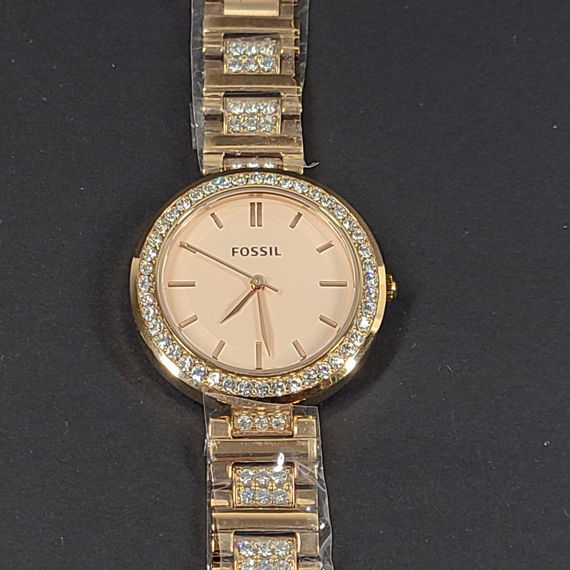 Rose gold Fossil Karli three-hand stainless steel watch with a minimalist round dial and bracelet band.