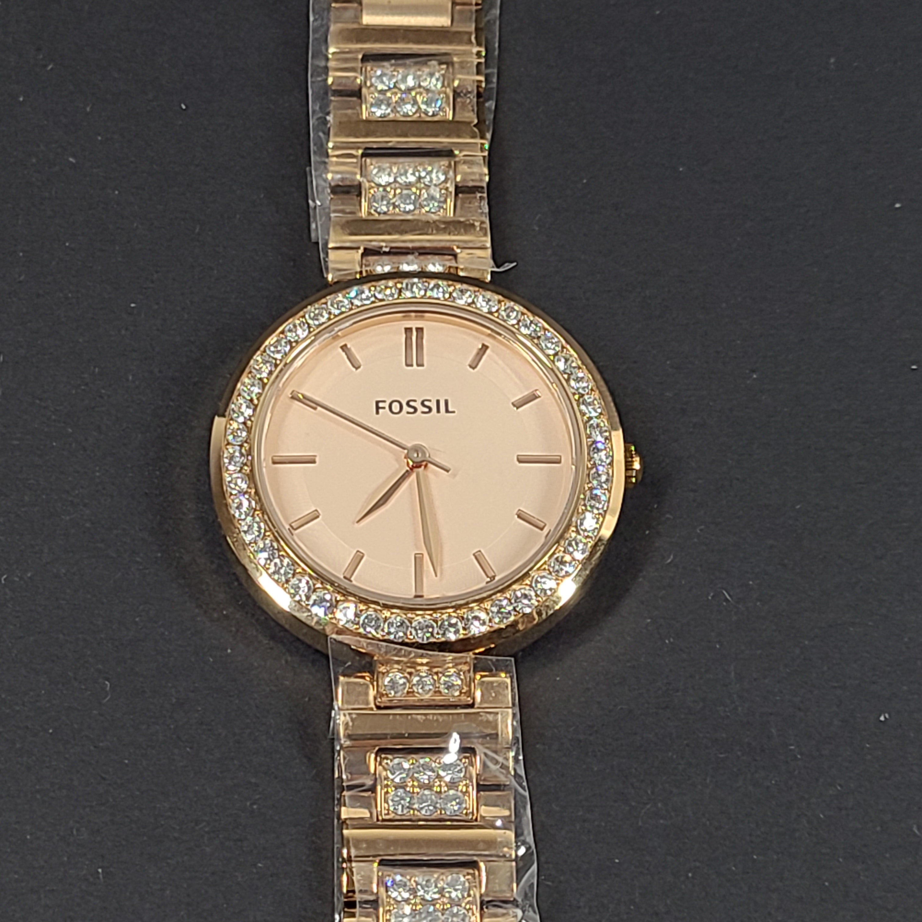 Rose gold Fossil Karli three-hand stainless steel watch with a minimalist round dial and bracelet band.