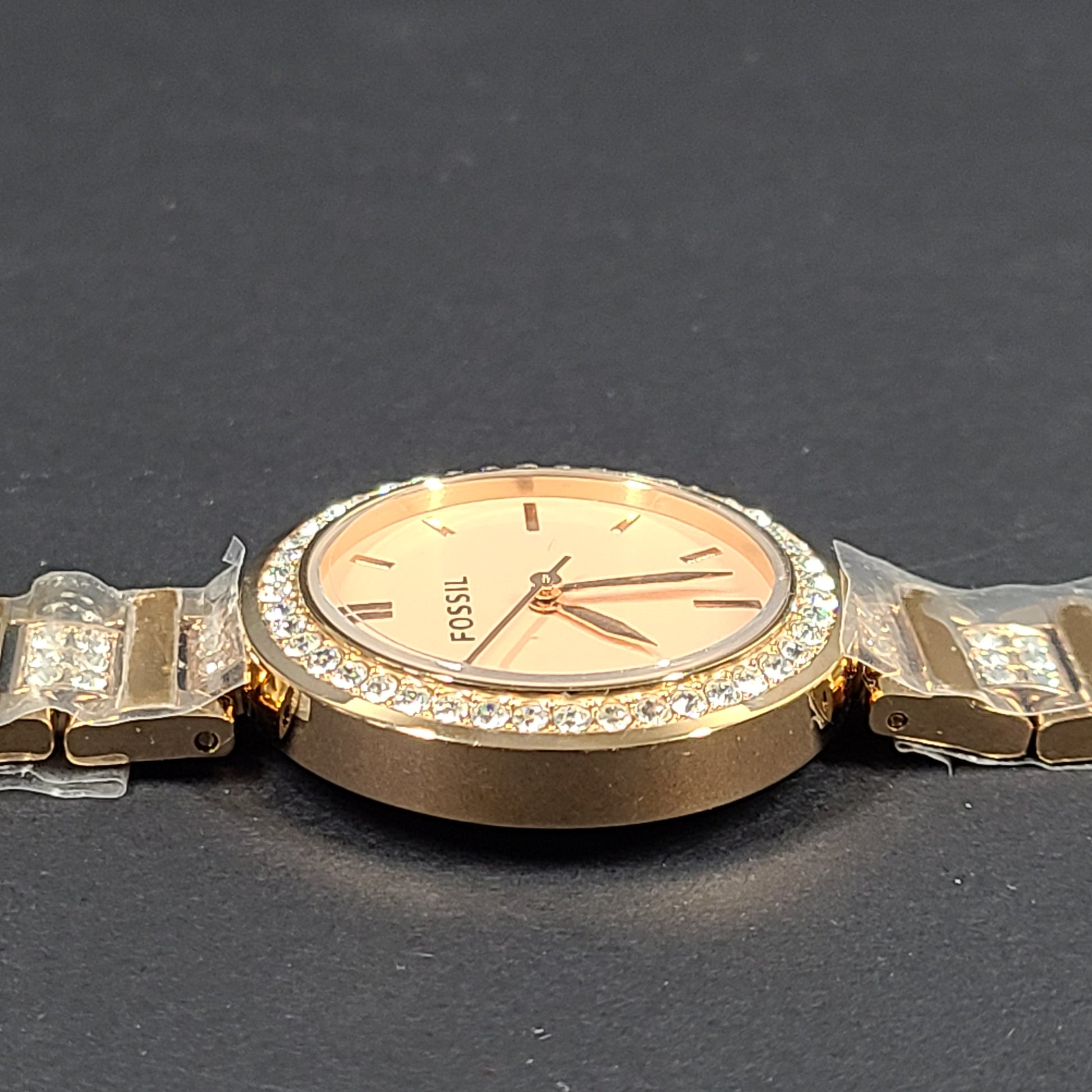 Rose gold Fossil Karli three-hand stainless steel watch with a minimalist round dial and bracelet band.