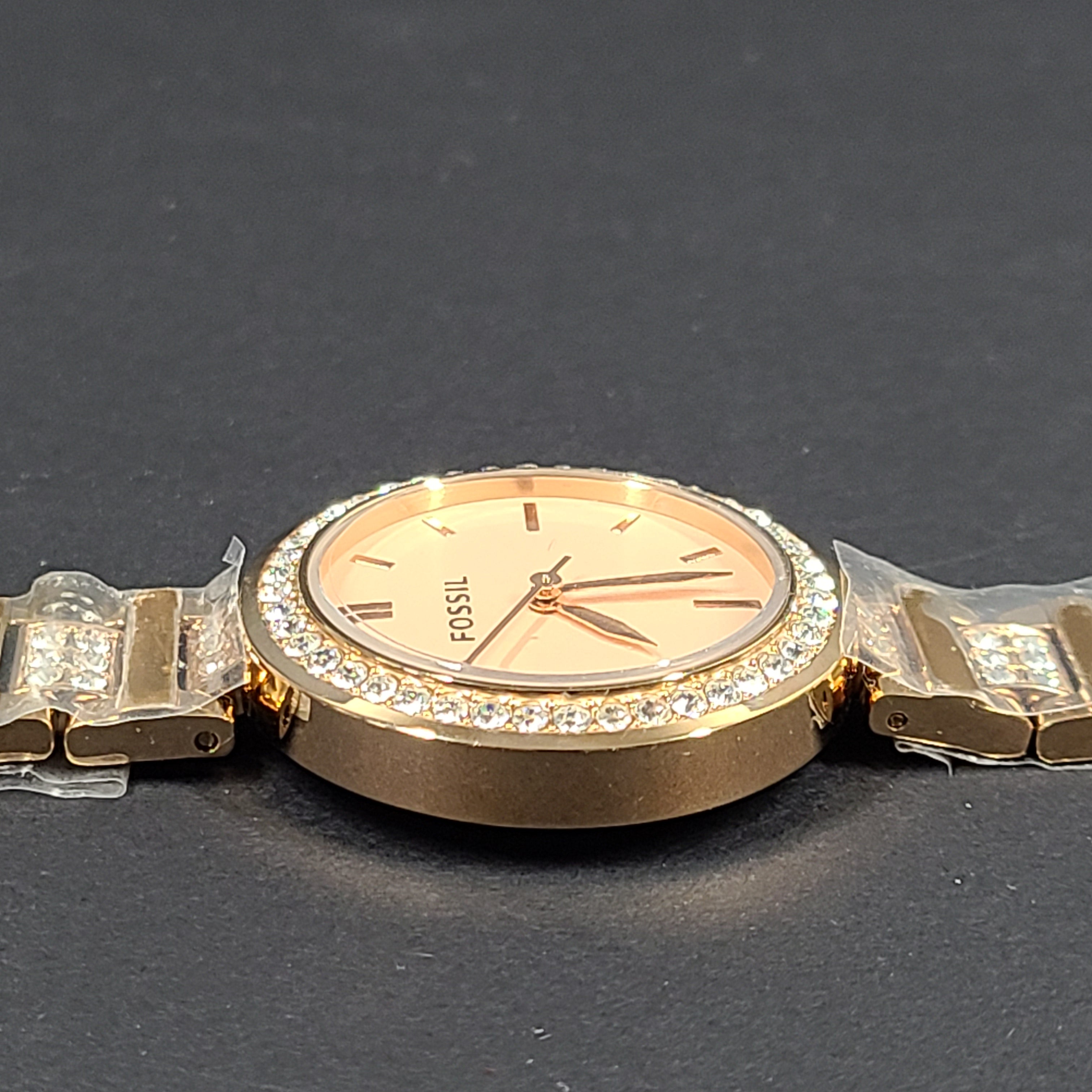 Rose gold Fossil Karli three-hand stainless steel watch with a minimalist round dial and bracelet band.