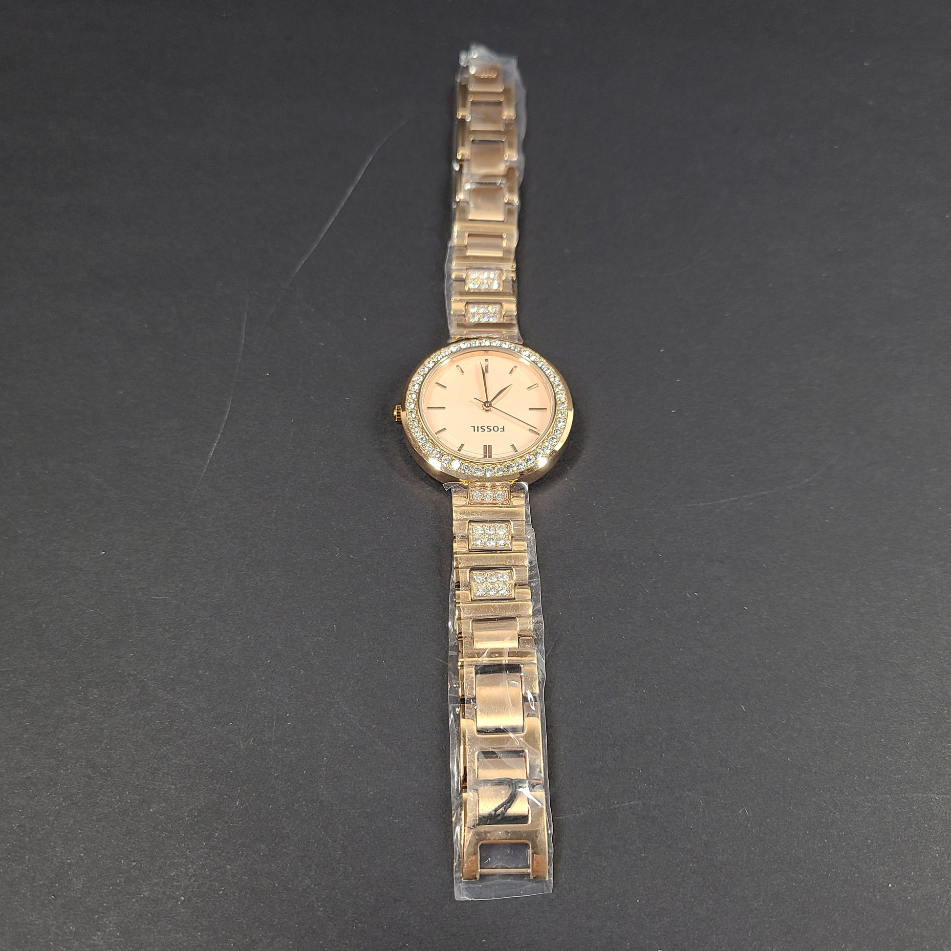 Rose gold Fossil Karli three-hand stainless steel watch with a minimalist round dial and bracelet band.