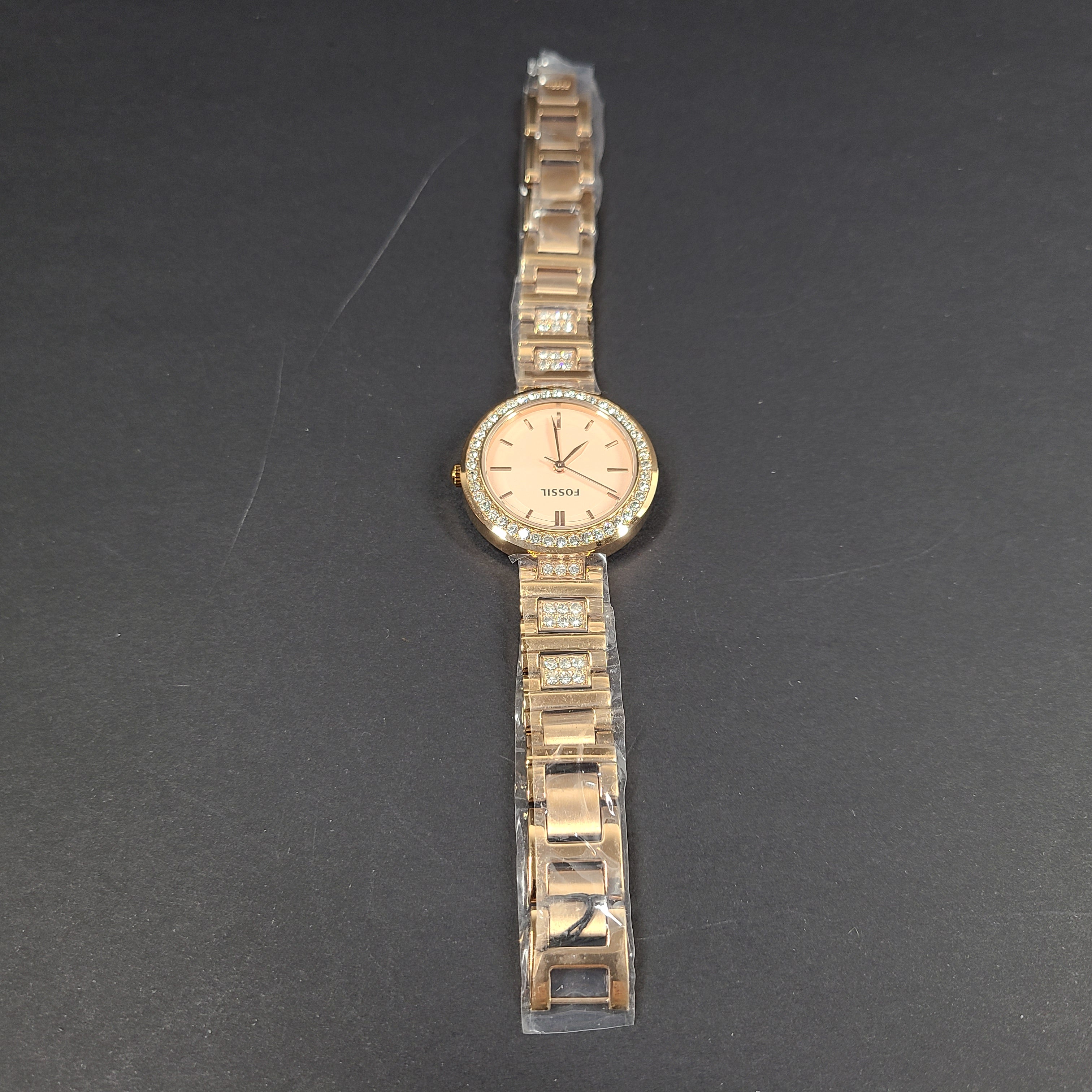 Rose gold Fossil Karli three-hand stainless steel watch with a minimalist round dial and bracelet band.
