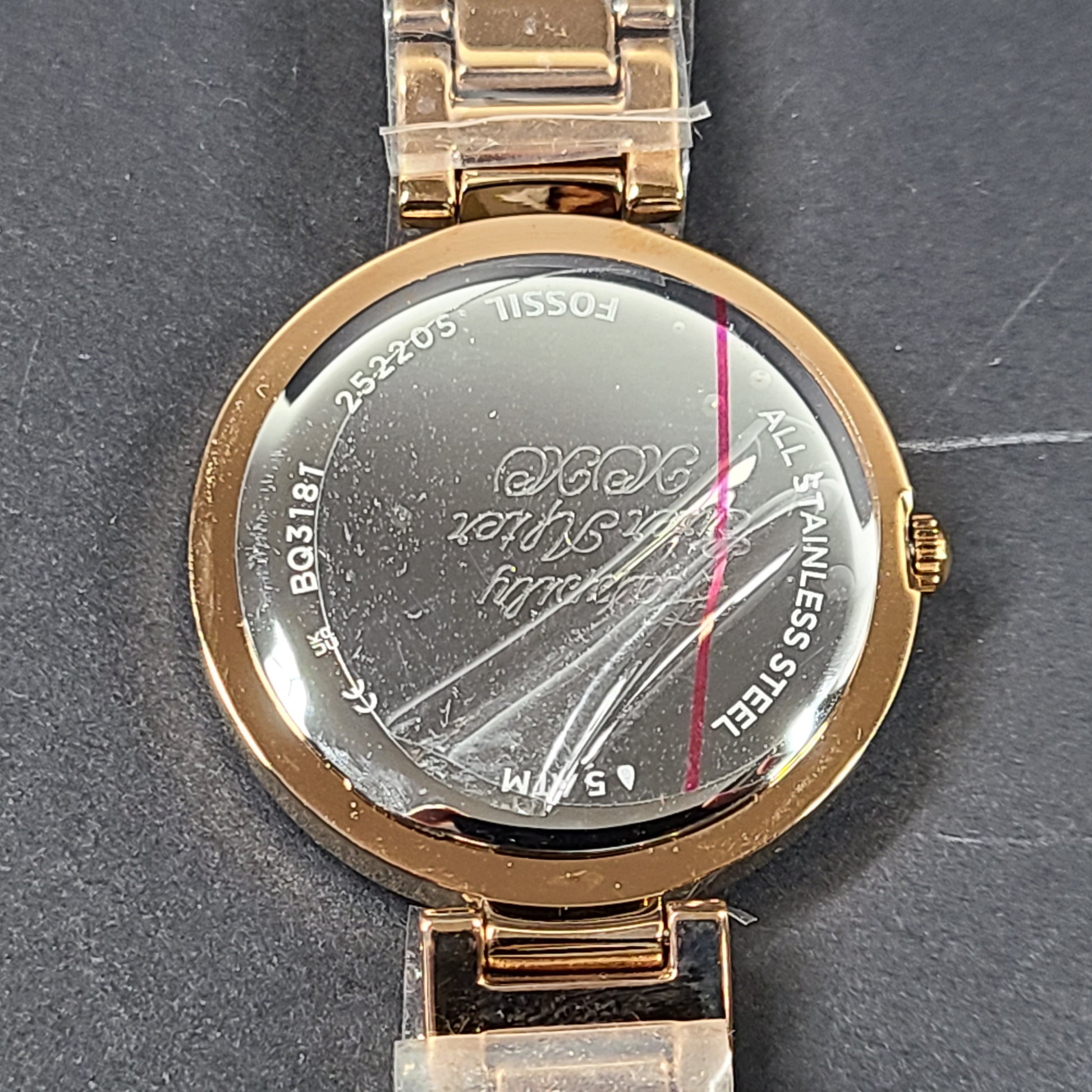 Rose gold Fossil Karli three-hand stainless steel watch with a minimalist round dial and bracelet band.