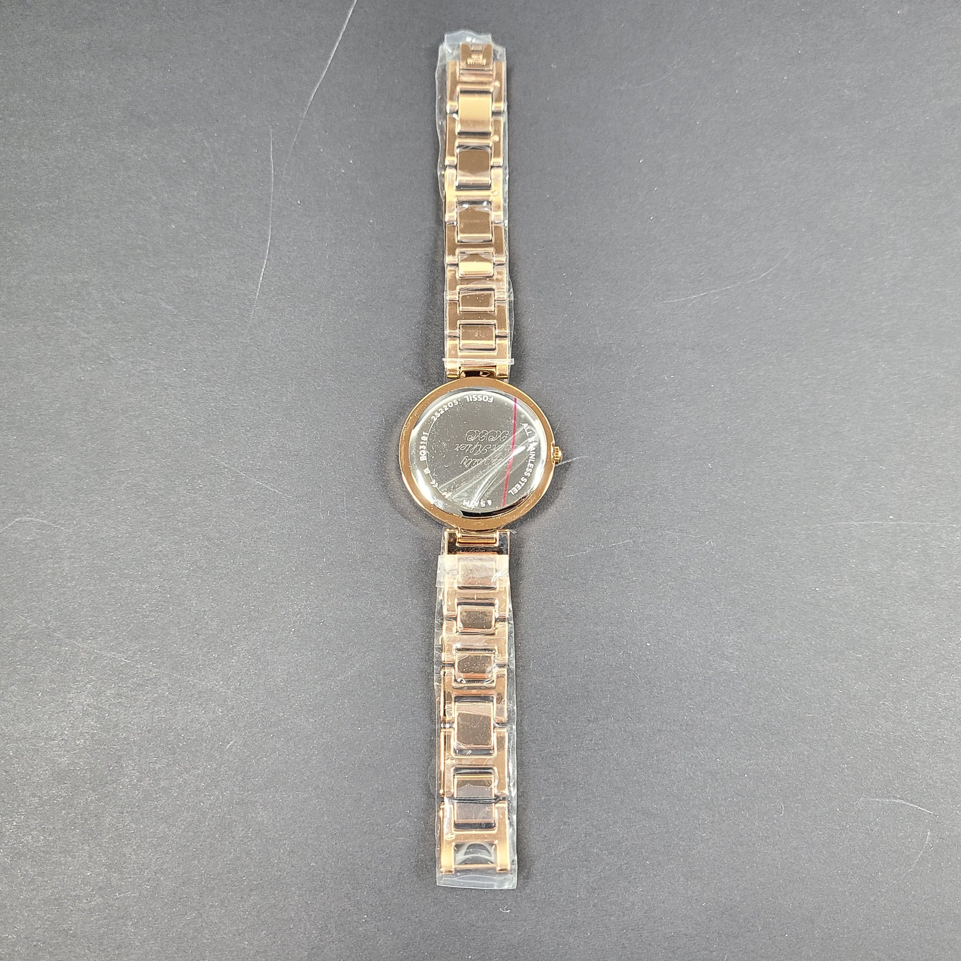 Rose gold Fossil Karli three-hand stainless steel watch with a minimalist round dial and bracelet band.