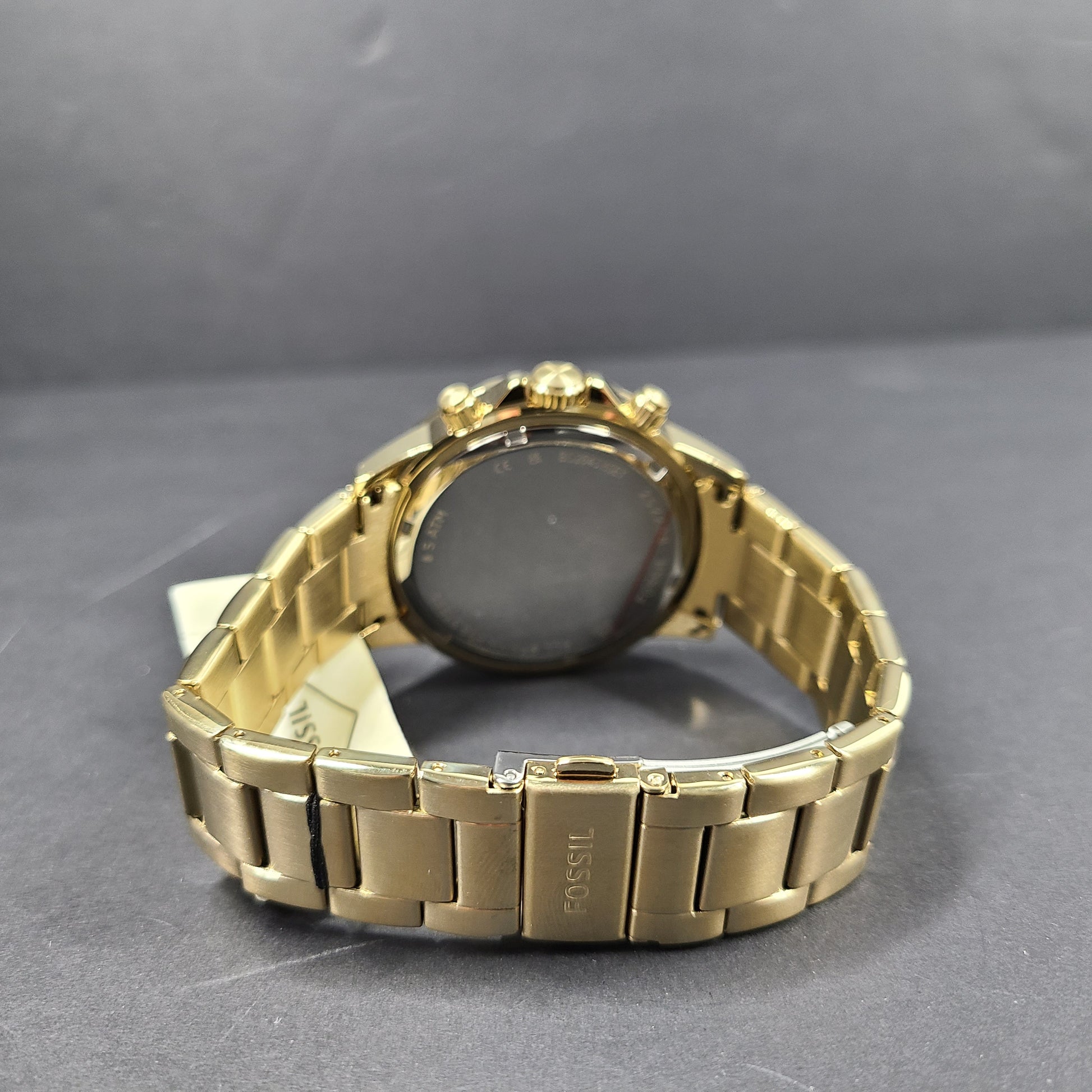 Gold stainless steel Fossil BQ2643MSET wristwatch with bracelet and Japan movement.
