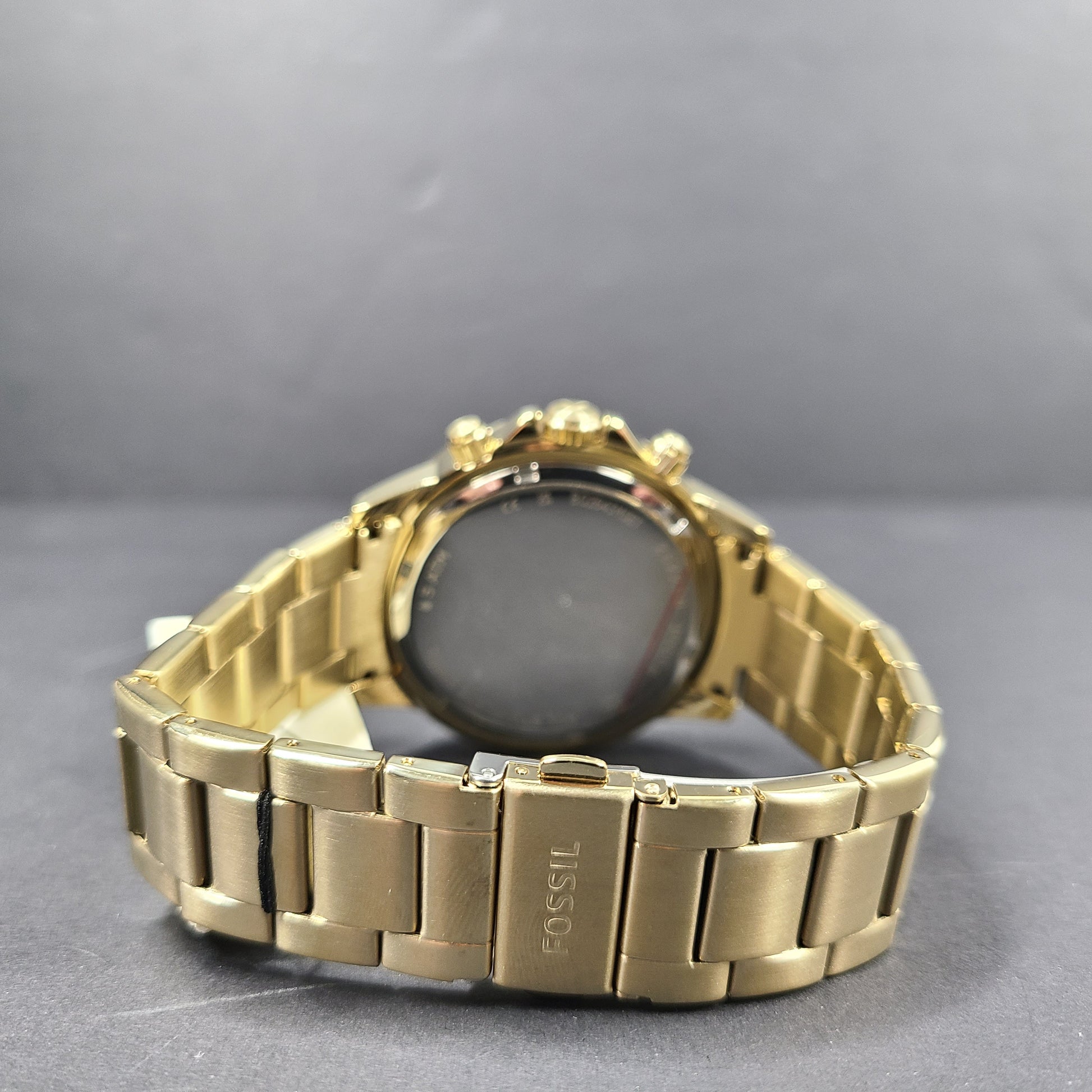 Gold stainless steel Fossil BQ2643MSET wristwatch with bracelet and Japan movement.