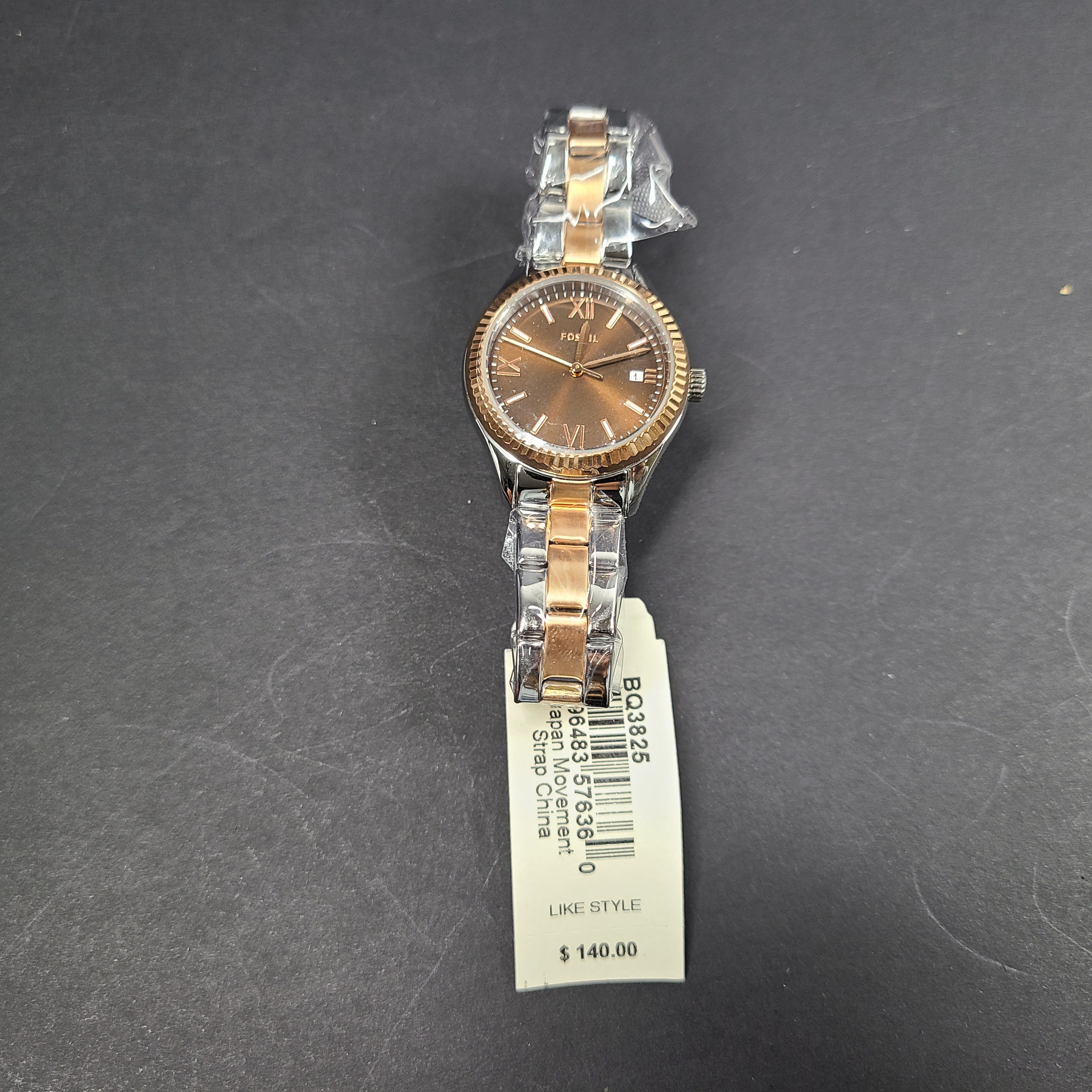 A two-tone Fossil Rye wristwatch with silver and gold stainless-steel bracelet and a date window.
