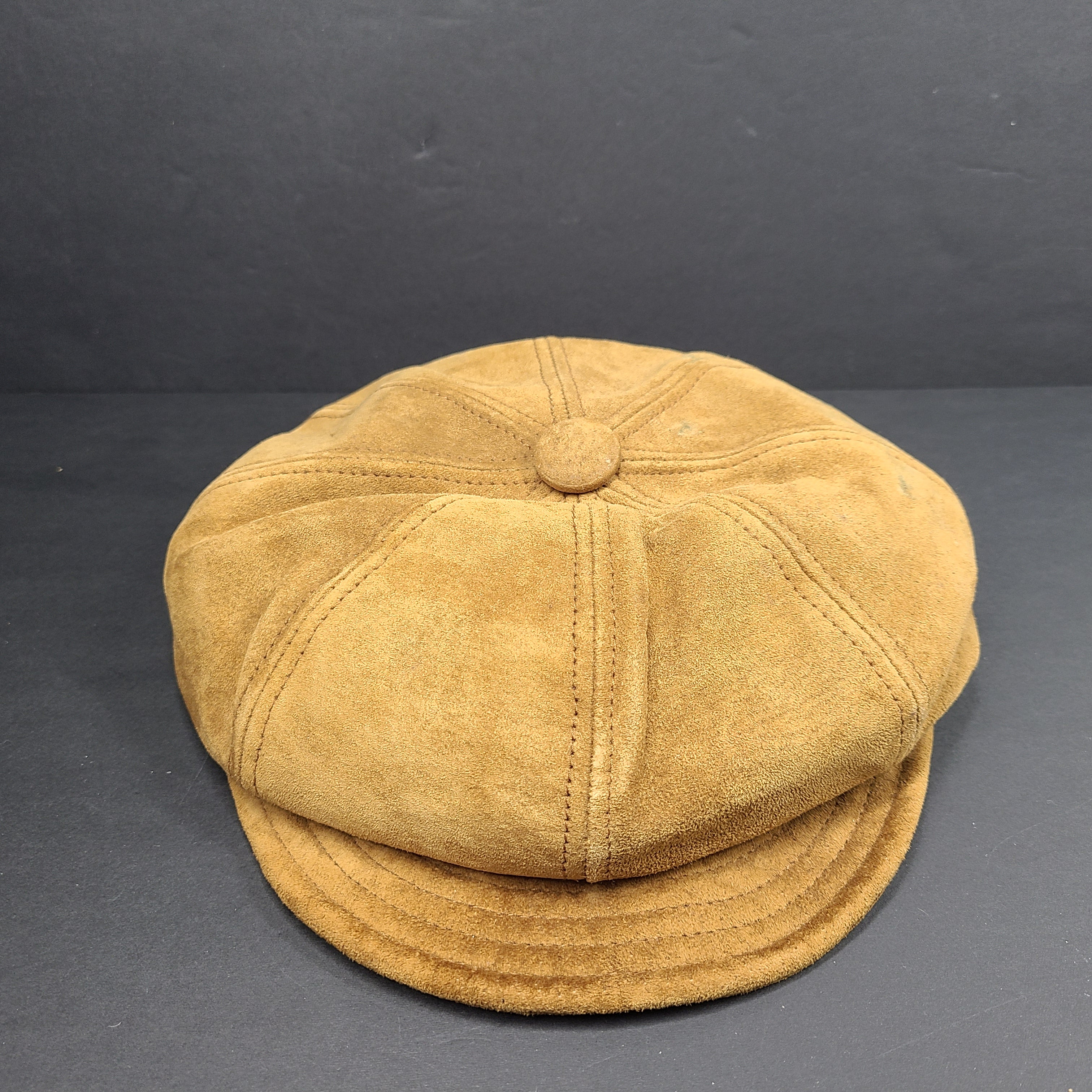 Goorin Bros medium brown suede cap with rounded crown and short brim.