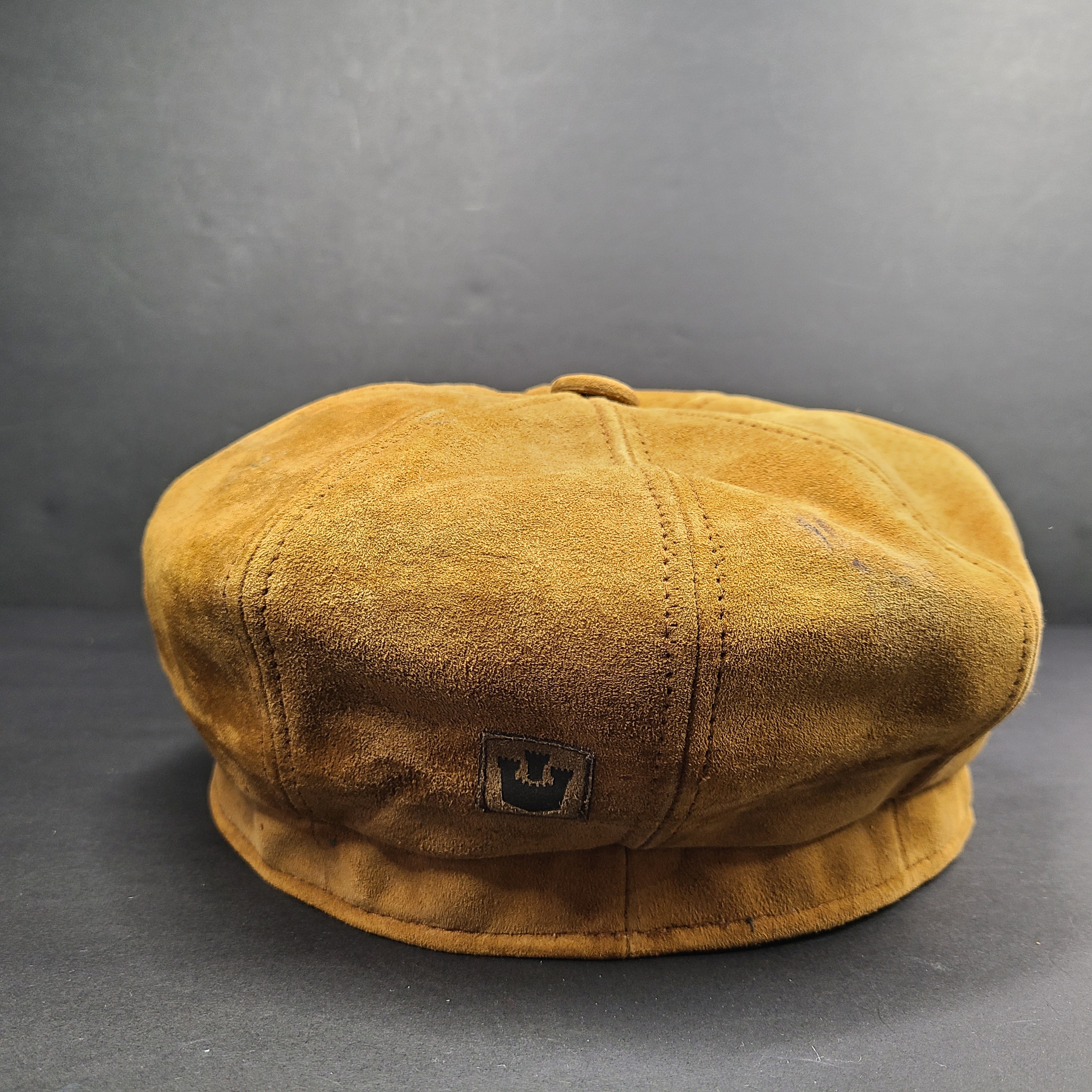 Goorin Bros medium brown suede cap with rounded crown and short brim.