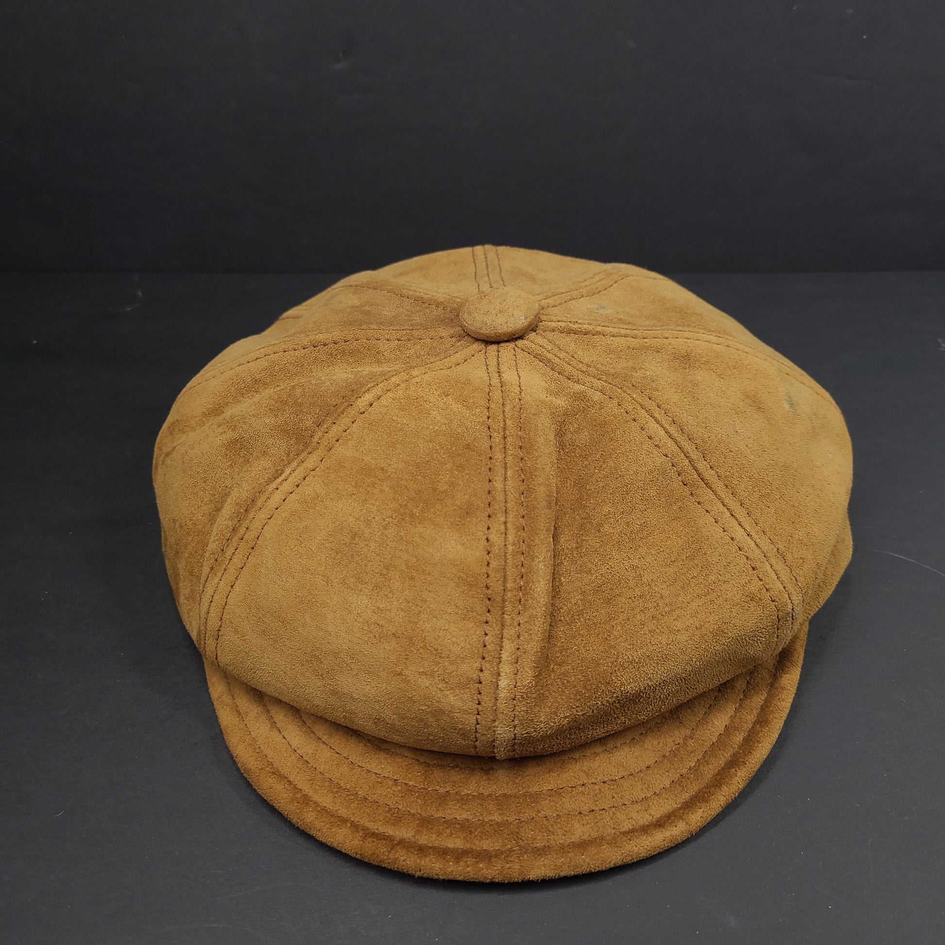 Goorin Bros medium brown suede cap with rounded crown and short brim.