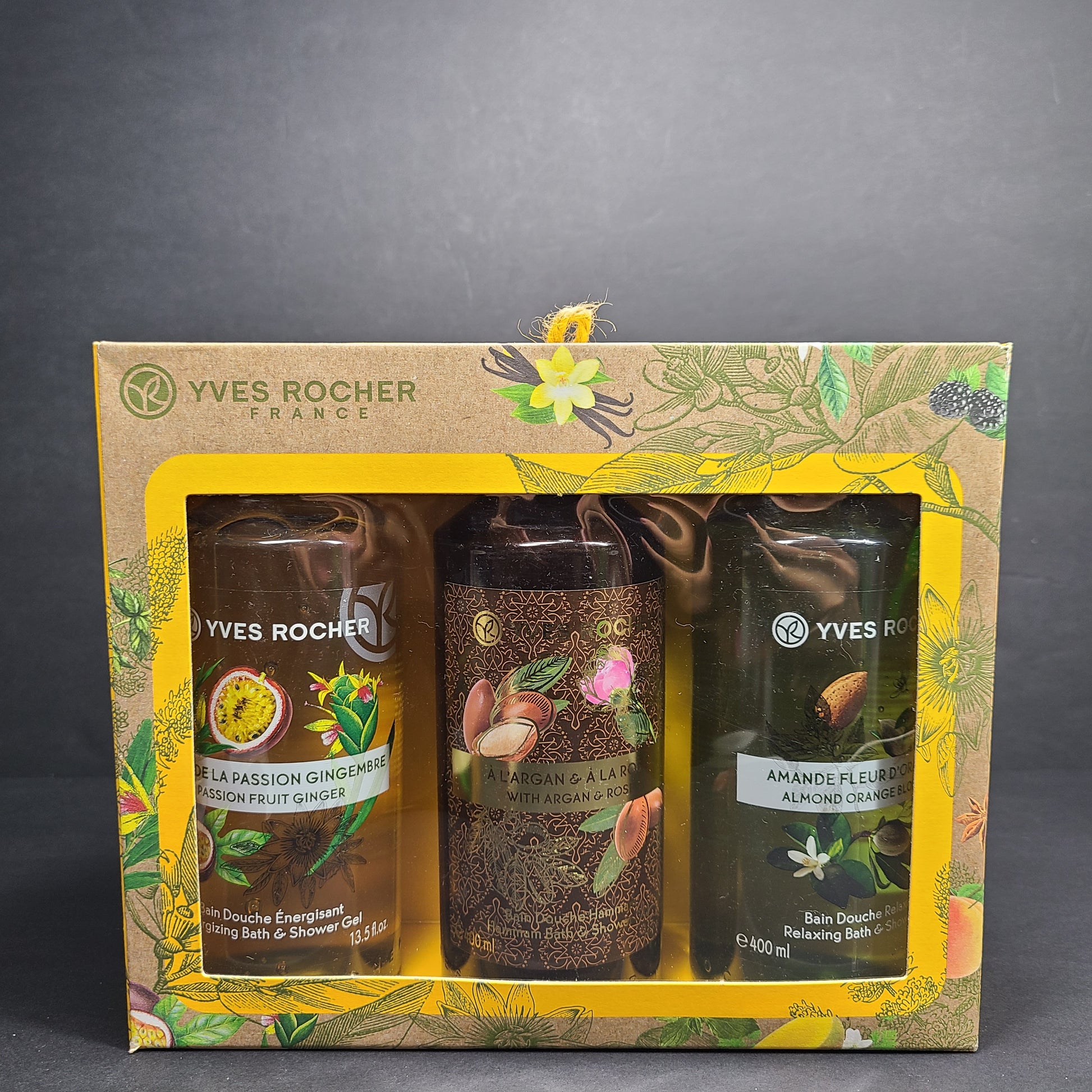 Three colorful Yves Rocher shower gels in Passion Fruit Ginger, Argan & Rose, and Almond Orange Blossom scents.