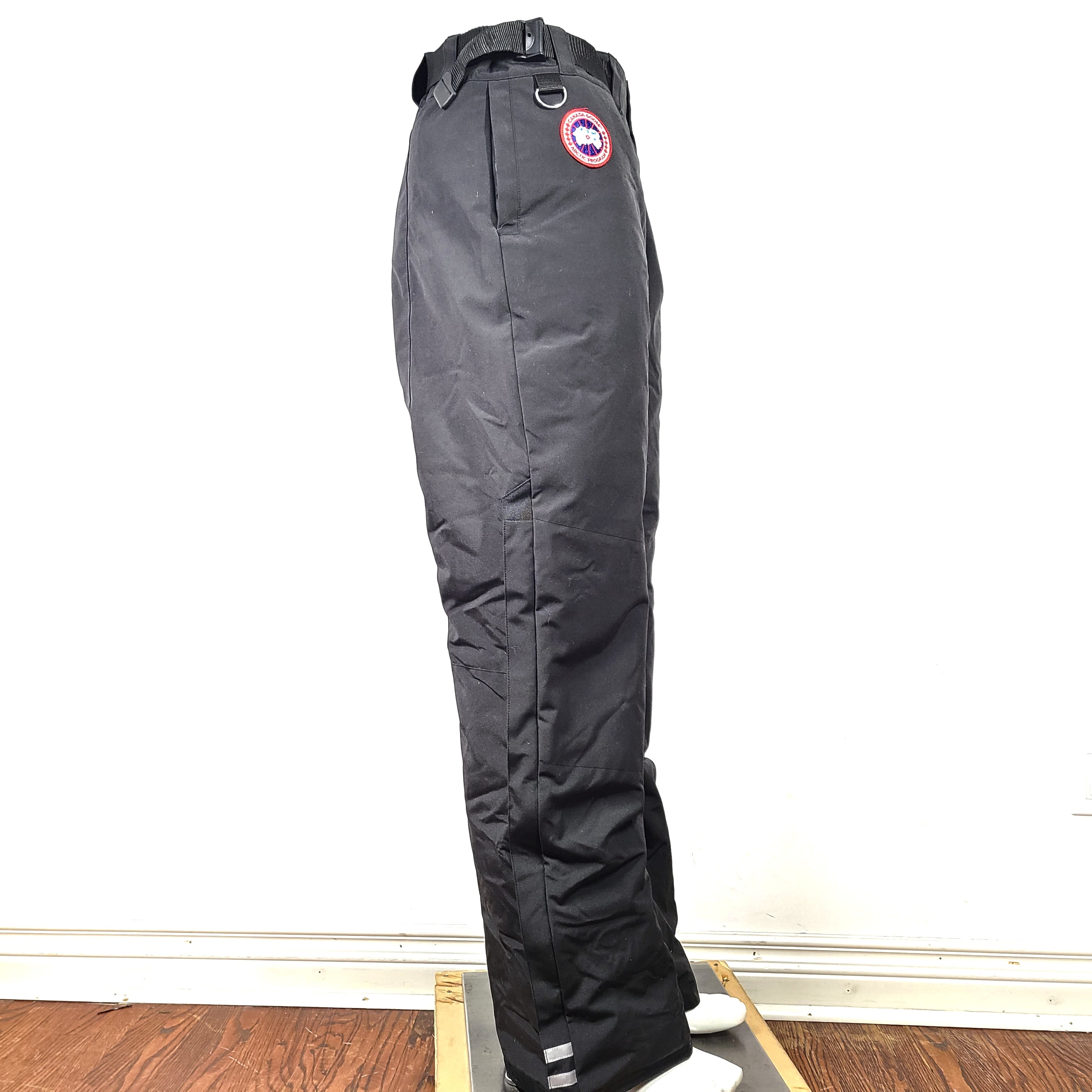Black Canada Goose Arctic Program pants in large size with reinforced construction for cold conditions.