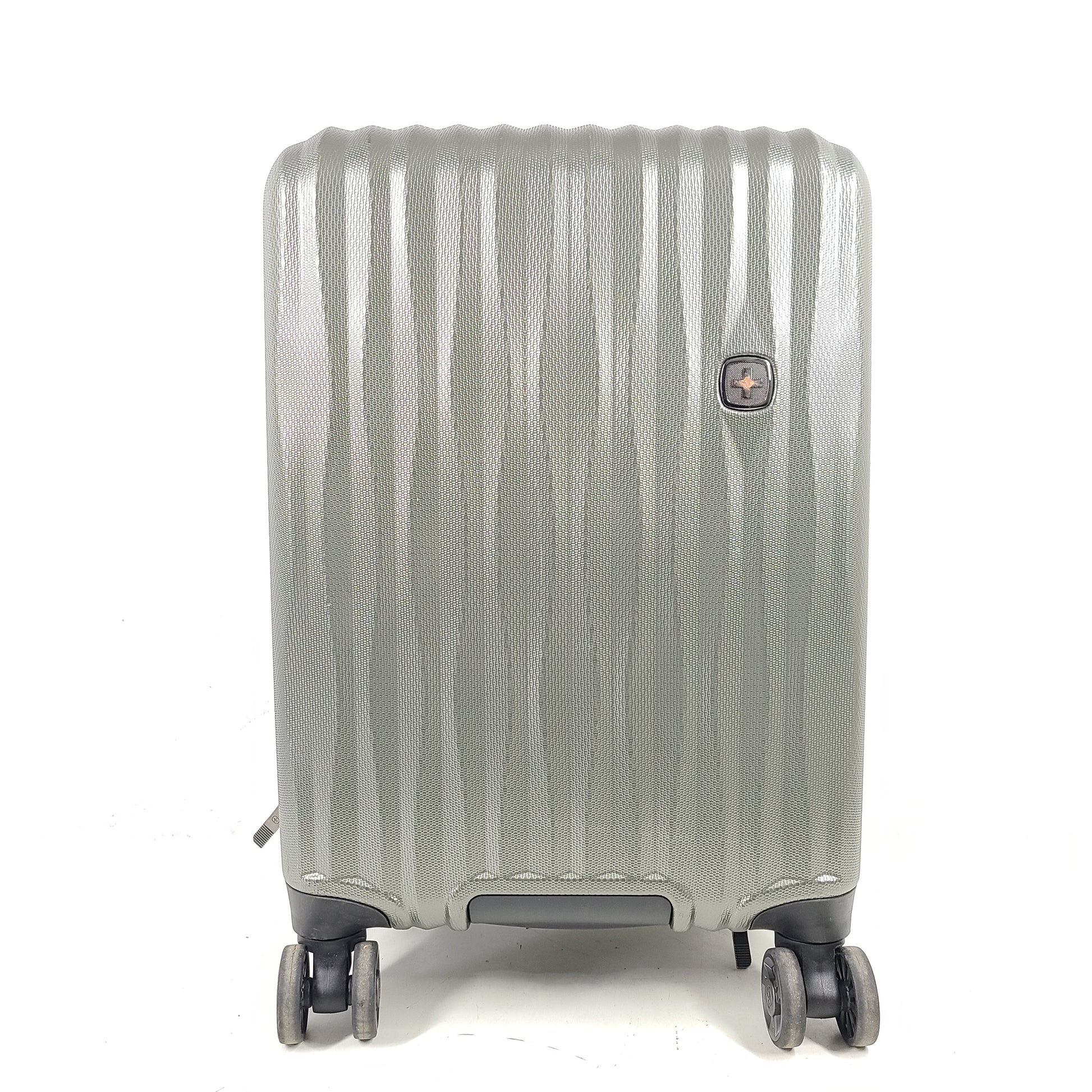 Swiss Gear silver hardside suitcase with embossed logo and light scuffs from regular use.