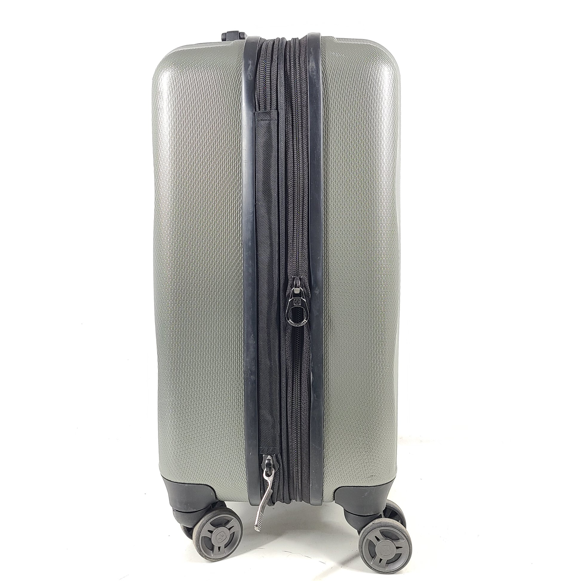 Swiss Gear silver hardside suitcase with embossed logo and light scuffs from regular use.