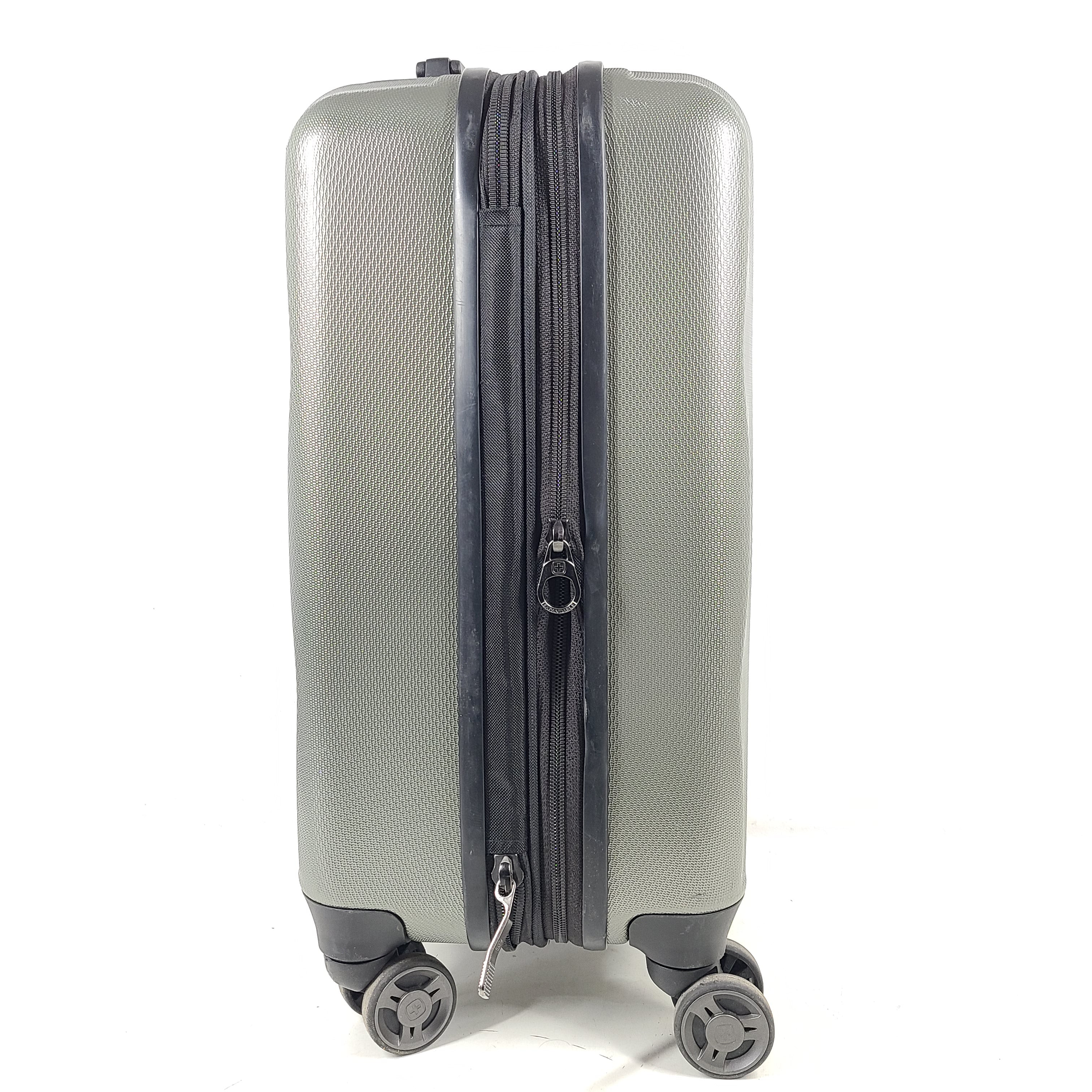 Swiss Gear silver hardside suitcase with embossed logo and light scuffs from regular use.