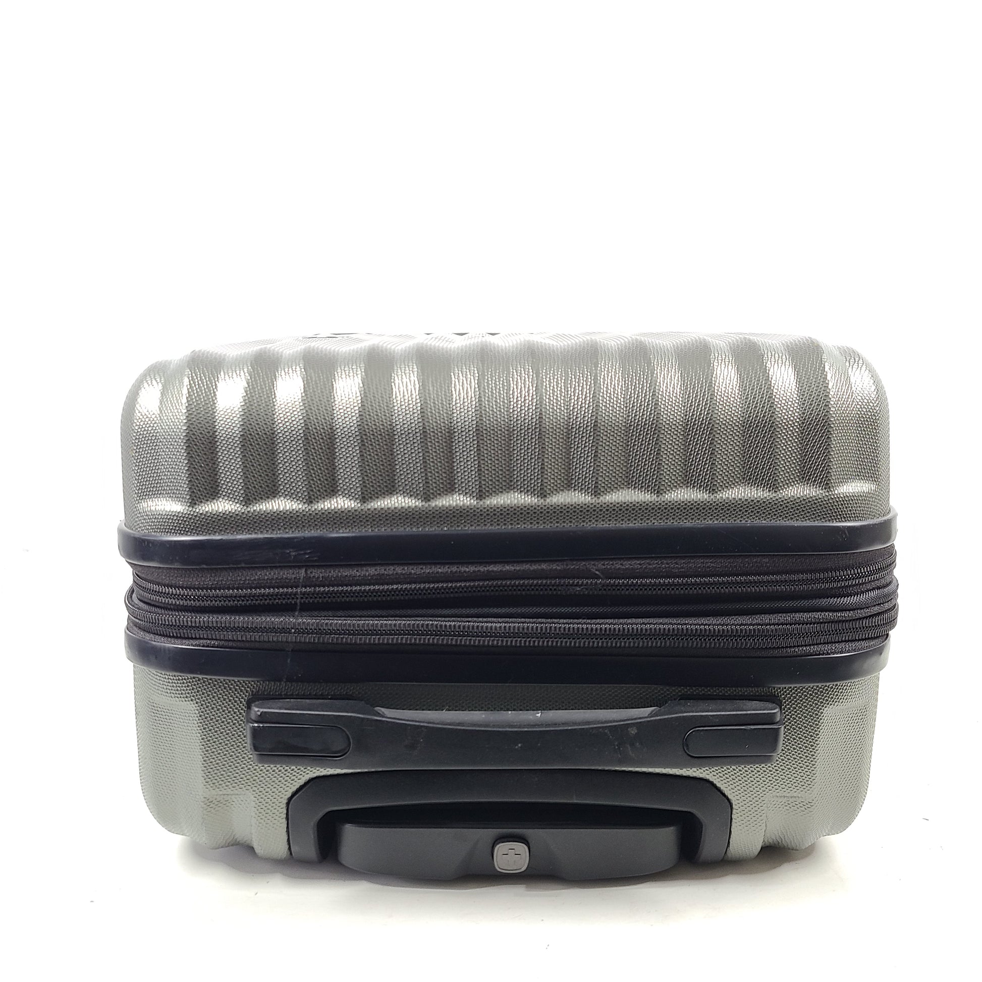 Swiss Gear silver hardside suitcase with embossed logo and light scuffs from regular use.