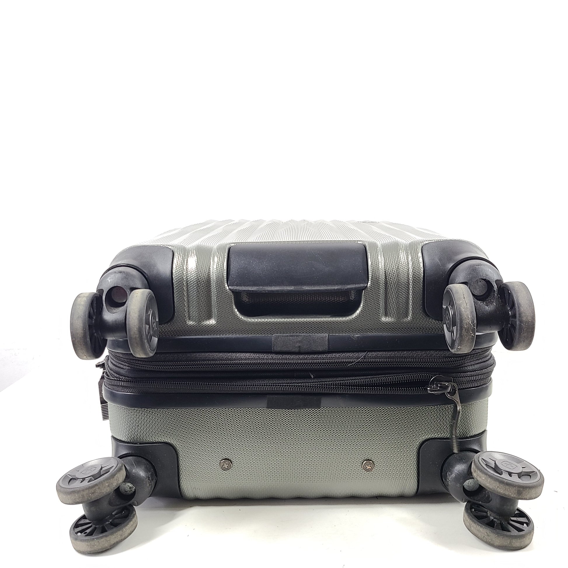 Swiss Gear silver hardside suitcase with embossed logo and light scuffs from regular use.