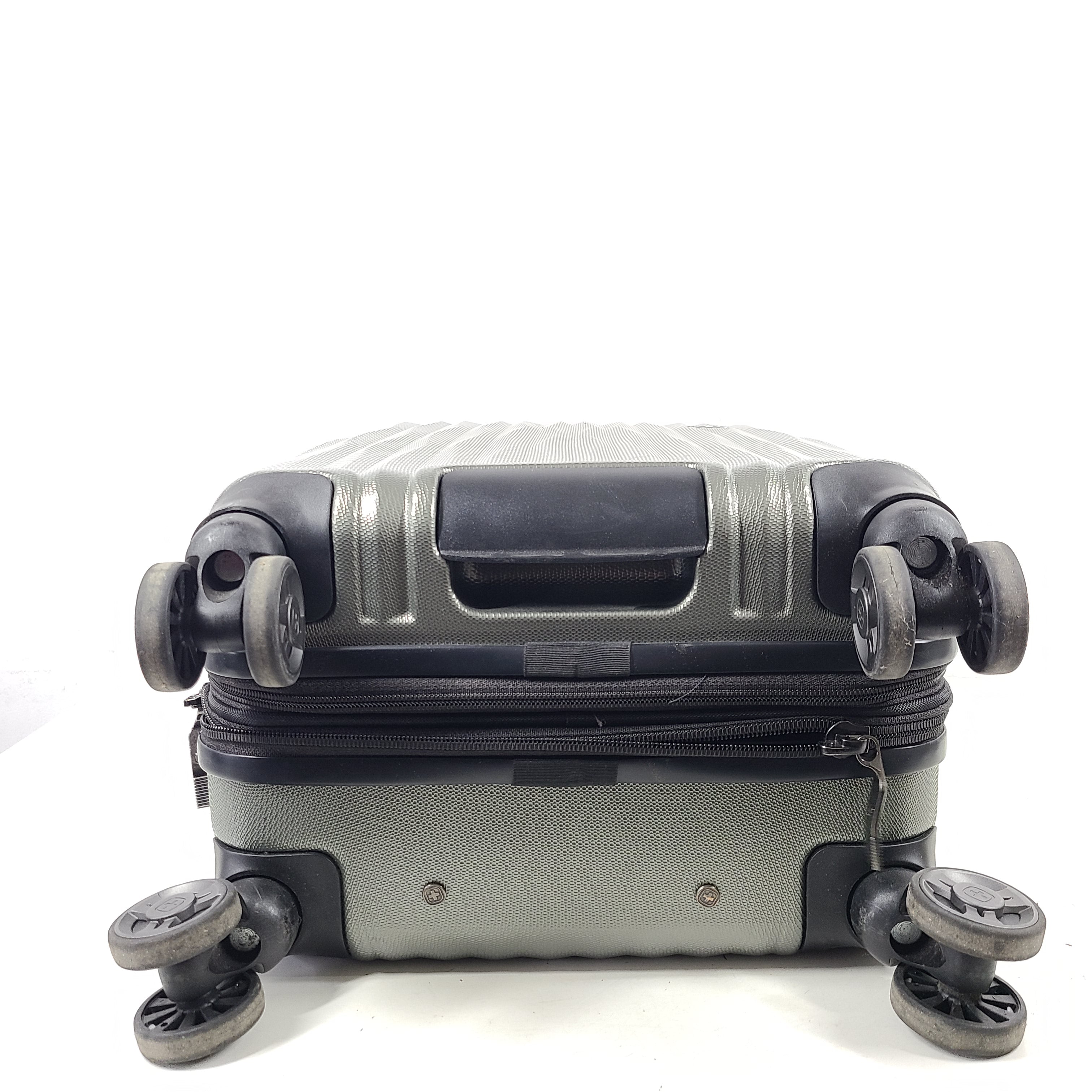 Swiss Gear silver hardside suitcase with embossed logo and light scuffs from regular use.