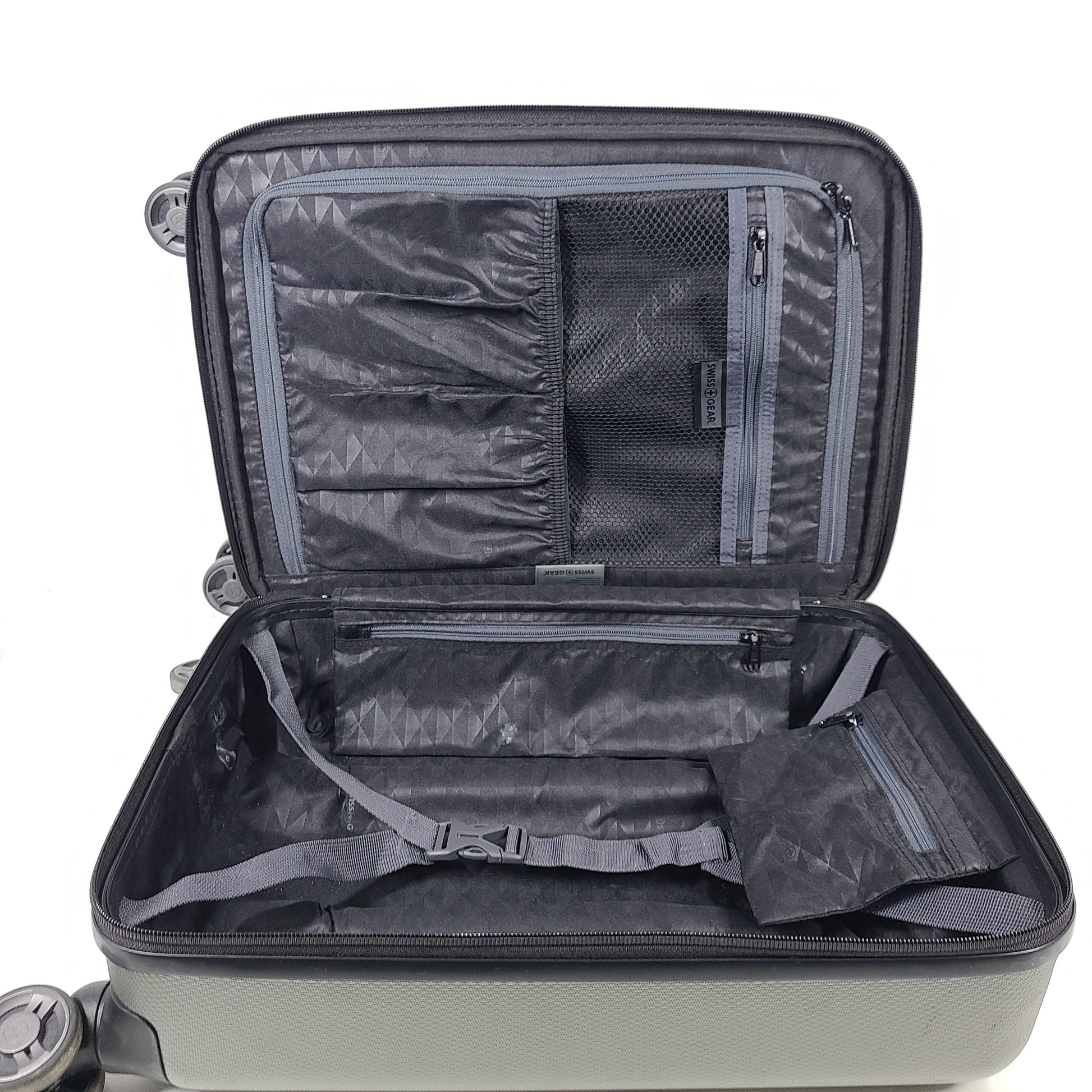 Swiss Gear silver hardside suitcase with embossed logo and light scuffs from regular use.