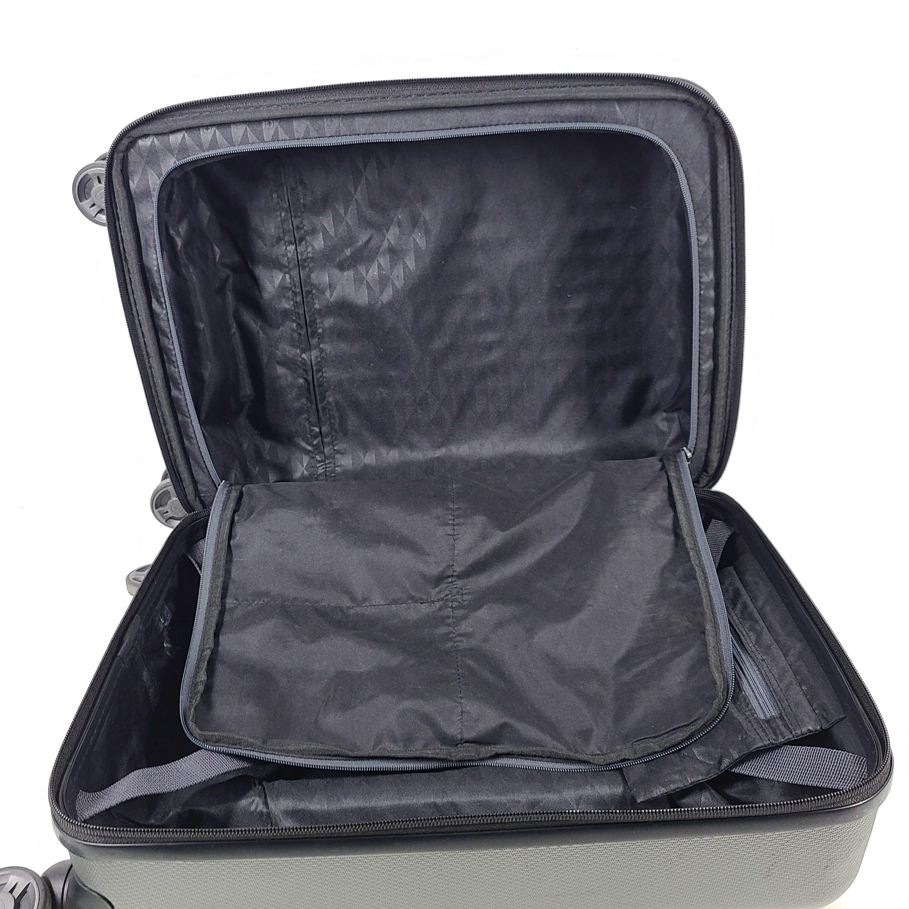 Swiss Gear silver hardside suitcase with embossed logo and light scuffs from regular use.