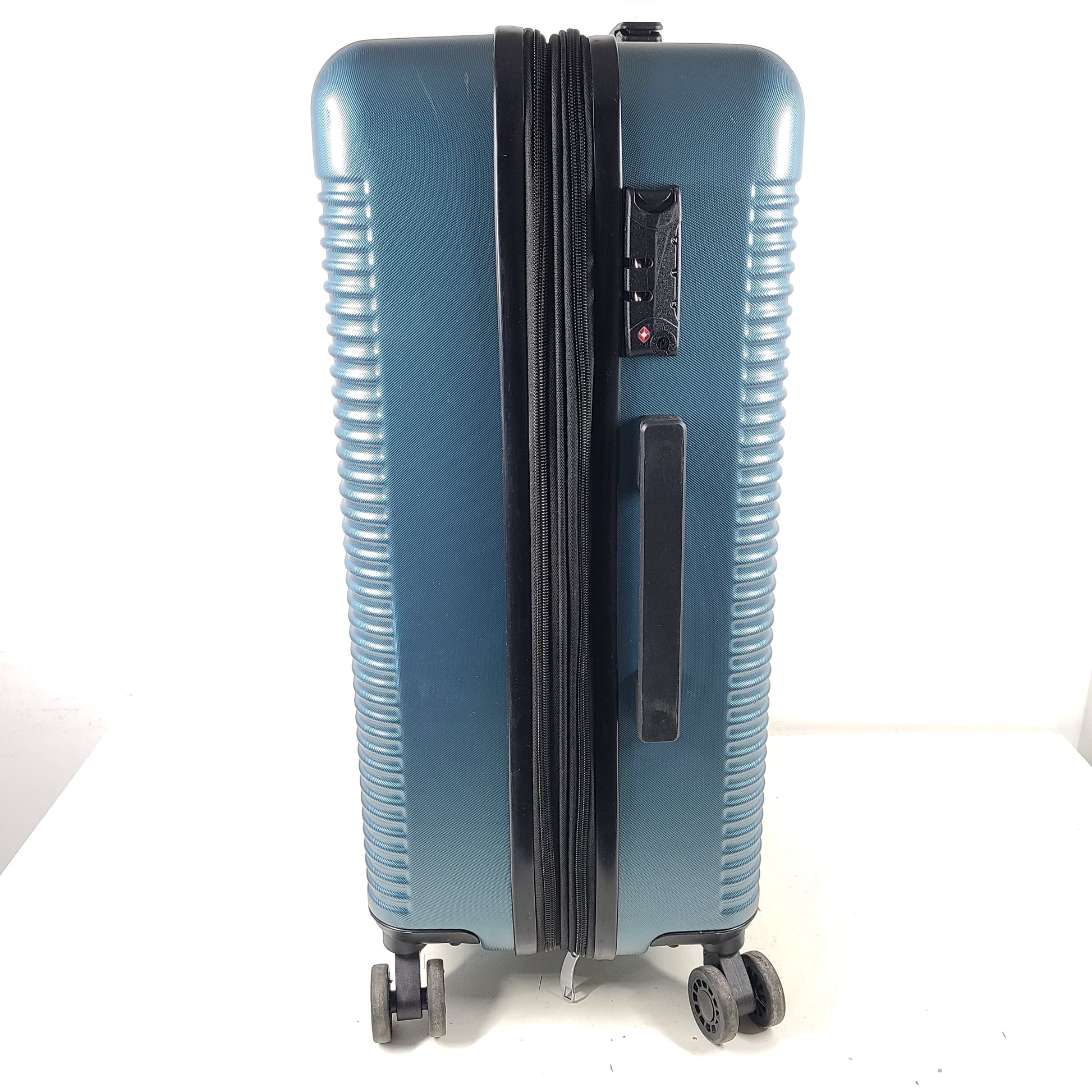 Samsonite blue hard-shell spinner luggage with front branding and a clean interior.